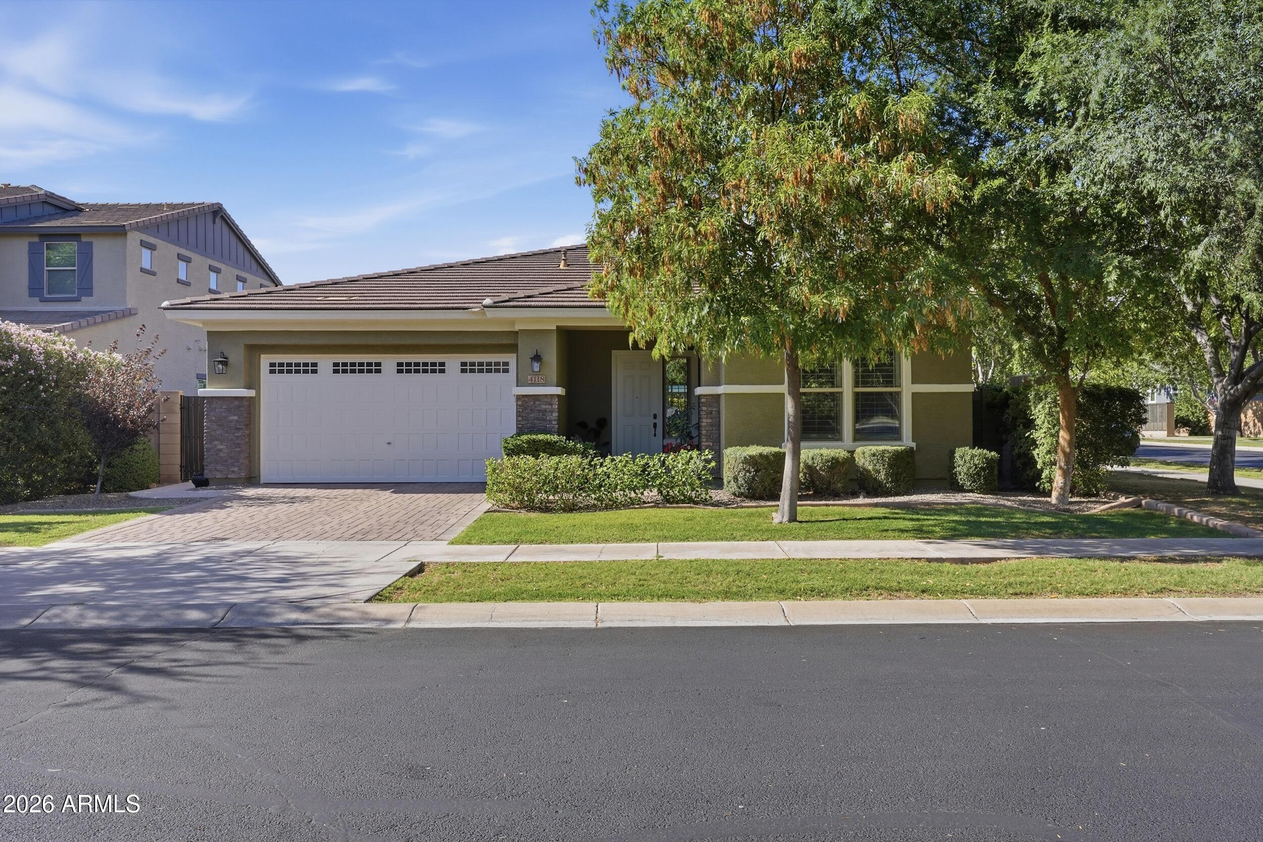 Welcome to this beautifully appointed 3-bedroom, 3-bathroom home with a versatile office/den, nestled in the highly sought-after Morrison Ranch community. Thoughtfully designed with an open great room floor plan, this move-in ready residence offers the perfect blend of style, comfort, and functionality.

The stunning kitchen serves as the heart of the home, featuring granite countertops, stainless steel appliances, elegant pendant lighting, and a large island with seating--ideal for entertaining and everyday living. The spacious great room creates a seamless flow and inviting atmosphere for gathering with family and friends. The generous primary suite provides a relaxing retreat, complete with a spacious bedroom, a well-appointed bath featuring a walk-in shower, and large walk-in closet. 

A flexible office or den offers endless possibilities, whether used as a home office, playroom, fitness space, or additional living area. The three-car garage provides ample room for vehicles, storage, and hobbies.

Step outside to your private backyard oasis, where lush fruit trees, mature landscaping, and grassy areas in both the front and back yards create a serene setting. The covered patio is perfect for entertaining, outdoor dining, or simply relaxing while enjoying Arizona's beautiful weather.

Located in one of Gilbert's most desirable communities, Morrison Ranch is known for its tree-lined streets, timeless charm, and exceptional amenities. Residents enjoy scenic walking and biking paths, parks, playgrounds, lakes, pickleball courts, and abundant green space that foster an active and connected lifestyle.

This exceptional home offers the ideal combination of elegance, warmth, and everyday convenience in one of Gilbert's premier neighborhoods. Don't miss the opportunity to make this beautiful home your own!