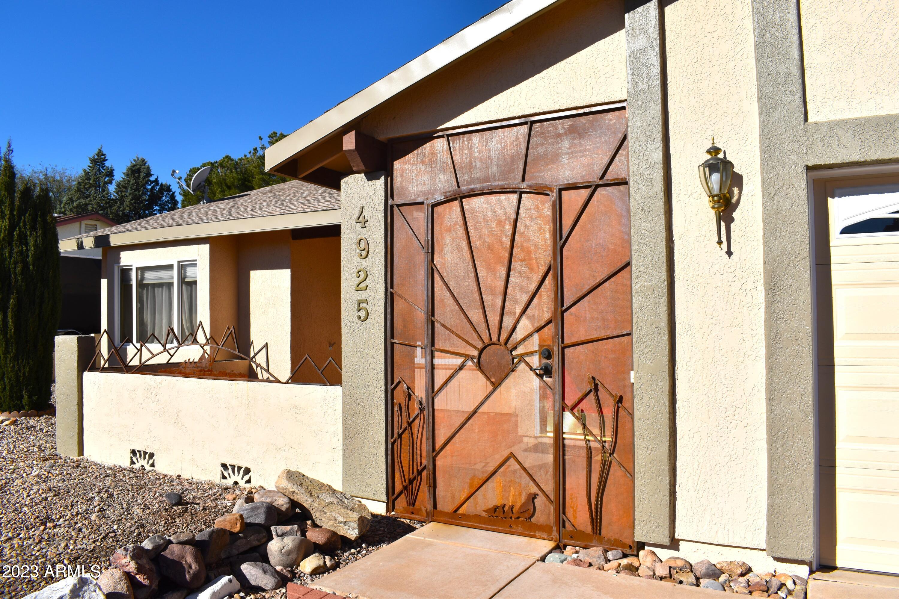 WELCOME HOME! This beautiful and well kept property has an amazing front patio with beautiful Wrought Iron gate to welcome you in. Gorgeous front door opens to a spacious living room with vaulted ceilings, plantation shutters and tile flooring in all the high traffic areas. The kitchen is updated with granite counters, plenty of storage and a double oven. This SPLIT floorplan is currently being used as a 3 bedroom with an office, but can easily be converted to a full 4 bedroom home. VERY LARGE back patio with plenty of shade and a great sized yard for all your gardening or entertainment needs. The PAID OFF SOLAR is just an added bonus!! Schedule your showing TODAY!