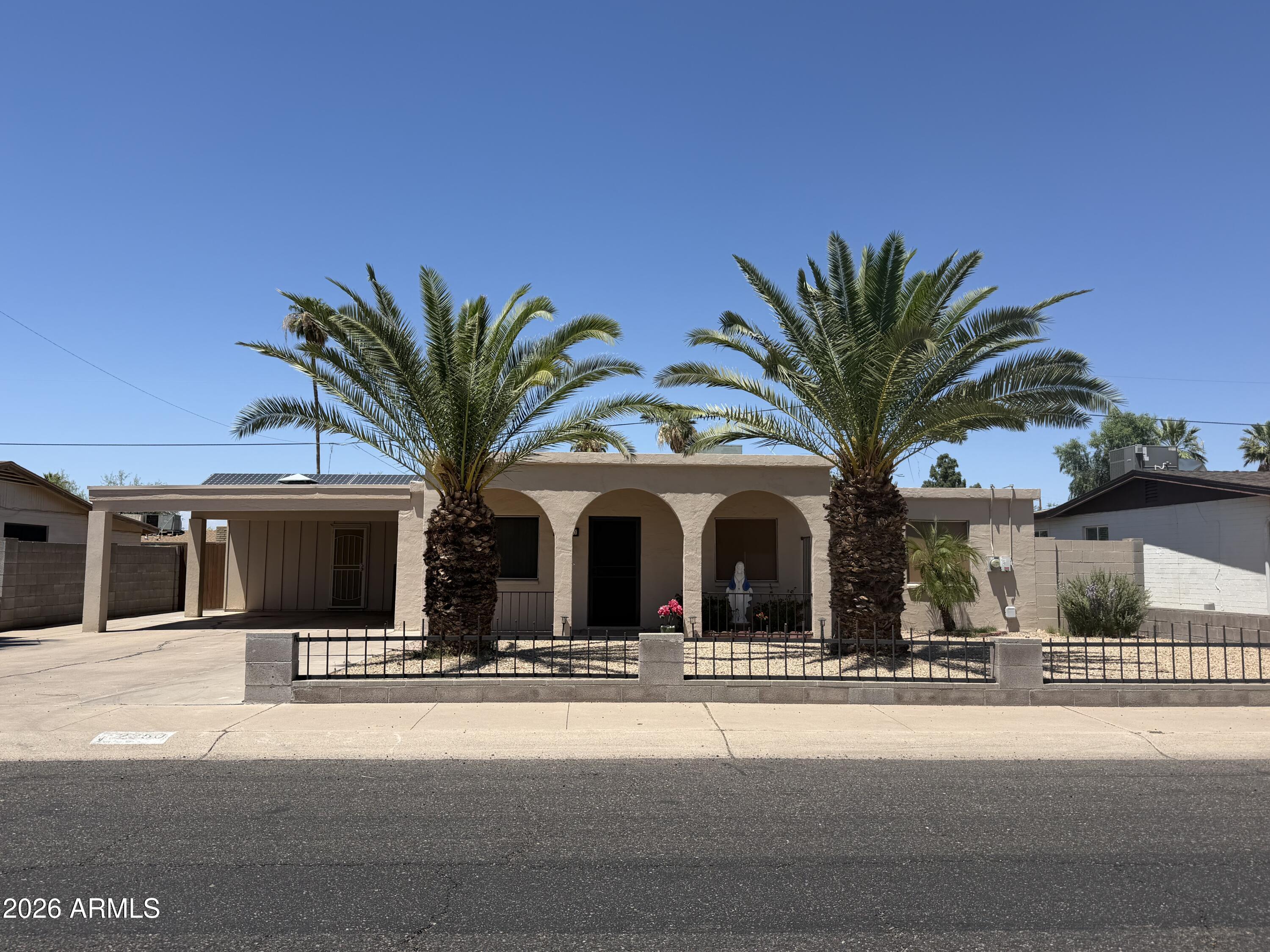 Well maintained move-in-ready 3-bedroom, 2-bath home close to Lookout Mountain Park, hiking trails, farmers markets and the Paradise Valley redevelopment. This home features a functional floor plan with abundant natural light, an updated kitchen with granite countertops tile flooring in the main areas, white interior palette. Flexible bonus room includes a large dog door leading to the backyard with paver patio and turf. Additional highlights include supplemental wall A/C units in each bedroom and bonus room, dimmer switches throughout, full-size washer and dryer, and a 2-car carport.