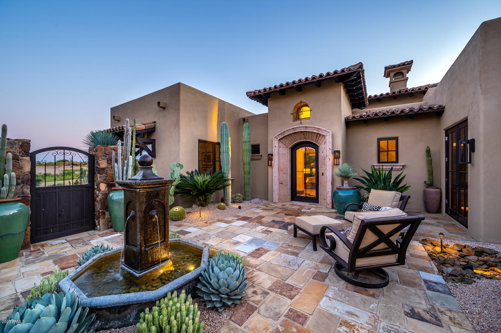 Featured in Luxe magazine and renovated by Turner Martin Design this home is a one of kind gem at Desert Mountain. The perfect open floorpan that every buyer is looking for in todays market.  The home is a split floor plan with four bedrooms all ensuite, plus a study with an adjacent full bath.  The idyll indoor-outdoor living is an entertainers delight.  The large patio features stone flooring, outdoor family room, pool, spa, chic pool bath with outdoor shower, custom fire pit, putting green and bbq area with sink, refrigerator and ice bin. Rare find at Desert Mountain to find great views of the valley and city lights from a lower village. The home also has wonderful views of magical sunsets and majestic mountains in the distance. The kitchen features quartz countertops, a Sub Zero refrigerator/freezer/wine cooler, thermadore gas cook top with griddle, double ovens and dishwasher. Oversized three car garage has epoxy floor and cabinets. See document section for list of upgrades to the home and featured article from Luxe magazine. All furniture and artwork is available by separate bill of sale.