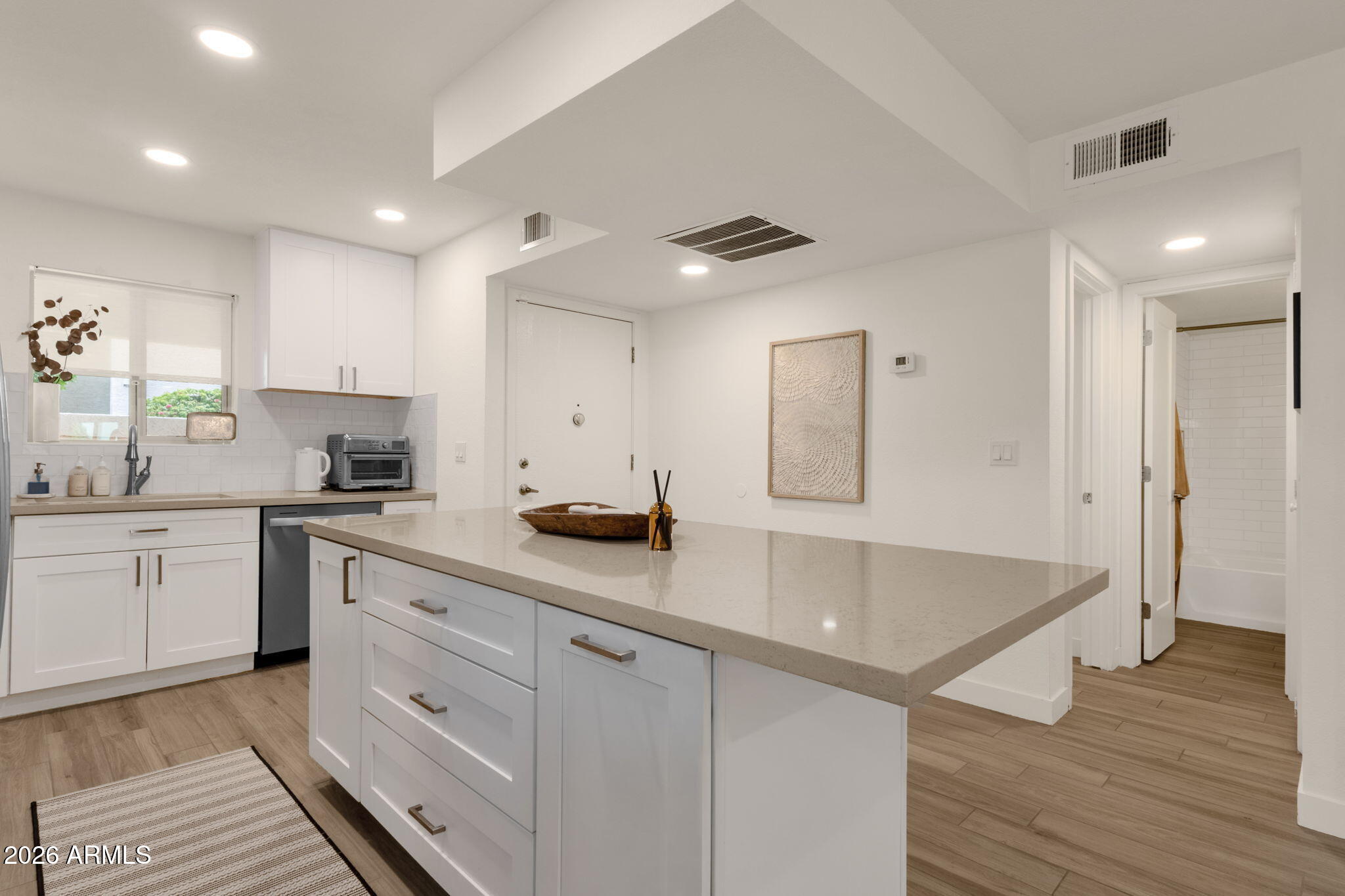 One of the few fully remodeled first-floor units available, this rare open-concept 2 bedroom END UNIT poolside residence is a standout opportunity. Showcasing like a model home w/ elevated designer finishes throughout, it ranks among the community's most refined offerings. It features all-new cabinetry, quartz countertops, stainless steel finishes, tile flooring, and a kitchen island that reflects a true love for cooking. Both bathrooms are fully updated. Enjoy a private gated courtyard entry & a spacious covered patio overlooking the pool, perfect for indoor-outdoor living. It offers exceptional privacy, natural light, & an open, airy feel. Bright living spaces flow seamlessly to the patio w/ direct pool access & mountain views. Ideally located near dining, shopping, & outdoor recreation.
