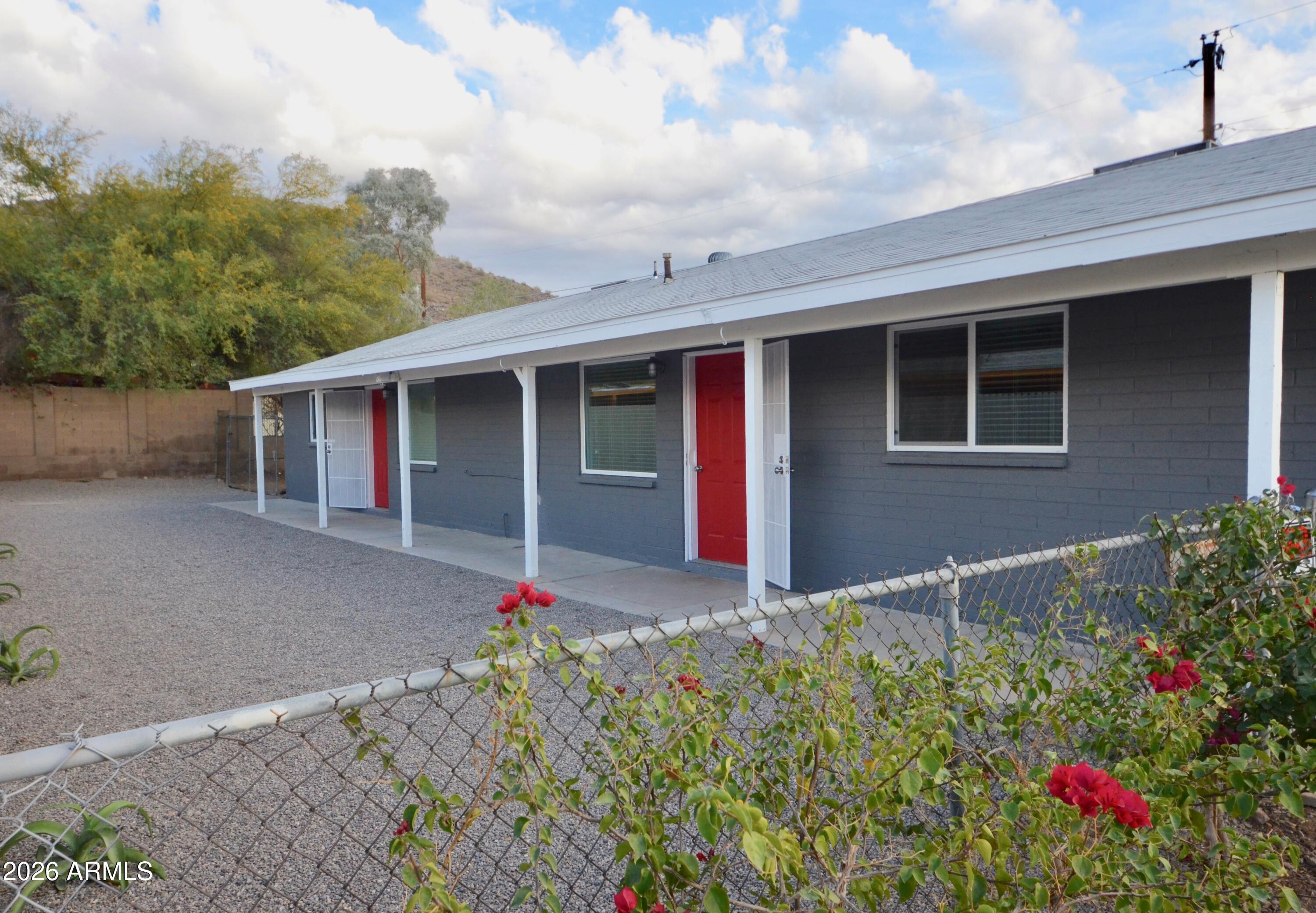 This is your chance to own a renovated, well maintained duplex in the North Mountain area of Phoenix featuring two fully upgraded 2 bedroom, 1 bathroom units, each with private yards, laundry, and mountain views. Live in one unit and rent out the other. Both units offer spacious layouts with newer kitchens and baths, in-unit laundry rooms with washer dryer, ample storage, private gated yards, and off-street parking. Recent upgrades include a new roof (2023), updated flooring, dual pane windows, quartz countertops, plumbing, electrical, and newer central AC with ducting. Large lot with alley access offers potential for additional parking or future ADU. Close to hiking trails, dining, & new development. One unit delivered vacant. Occupied back unit back unit rented at $1308.
