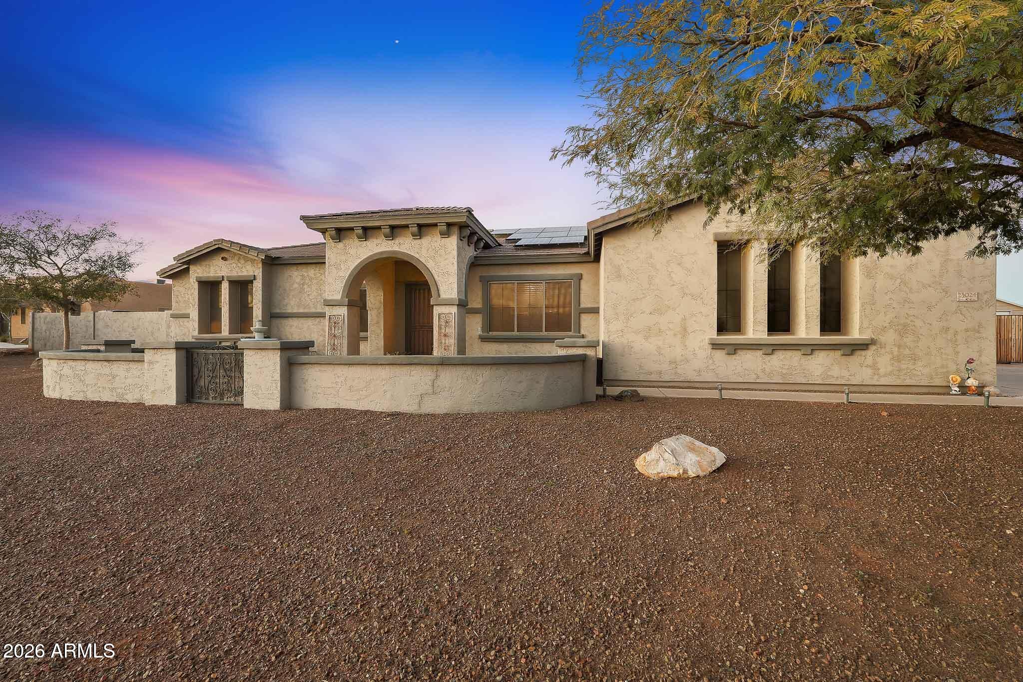 A rare opportunity to own the perfect blend of space, functionality, and modern comfort—ready to sell now! Situated on a full acre, this expansive 5-bedroom, 4-bath home offers over 3,155 sq. ft. of flexible living space ideal for multigenerational living, guests, or working from home. The layout includes two primary suites (or a private guest suite with its own entrance), Jack-and-Jill bedrooms, and a dedicated office or formal dining room.

The heart of the home is the spacious kitchen featuring granite countertops, a cooktop, double ovens, a walk-in pantry, and abundant counter space—perfect for entertaining and everyday living. contd.. The open floor plan flows seamlessly into the family and great rooms, anchored by a beautiful stone fireplace that creates a warm, inviting atmosphere.

Step outside to your own private backyard retreat with a stunning pool, powered ramada, and ample space for outdoor dining, entertaining, or simply relaxing while enjoying peaceful views. Owned solar adds both efficiency and long-term savings.

A dream setup for RV owners, hobbyists, and car enthusiasts:
The 3-car garage is plumbed for a shop sink with hot and cold water and waste, and includes a 50-amp outlet for RV or EV charging. The backyard features a plumbed RV dump station, along with an RV gate, RV parking, slab parking for additional vehicles, and a separate workshopideal for storage, projects, or toys.

Homes with this level of space, utility, and flexibility are raredon't miss your opportunity to make this one yours.