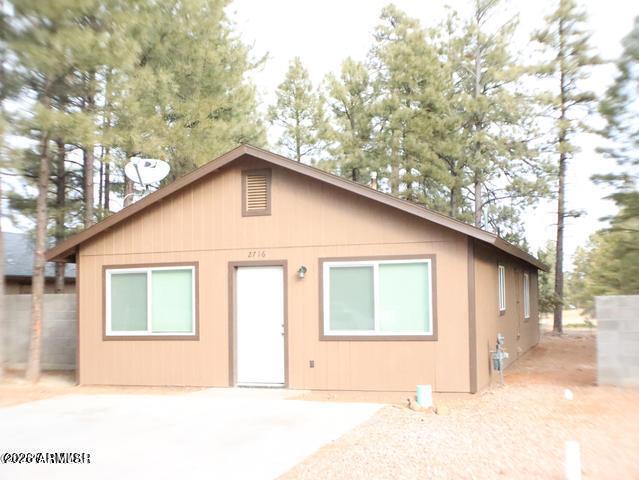 Built in 1998, this beautifully maintained home features 3 bedrooms, 2 full bathrooms, and a covered patio, making it the perfect primary residence, vacation getaway, or investment property. The inviting front entry opens into a spacious great room, while the bedrooms are thoughtfully situated toward the rear of the home for added privacy. The kitchen is equipped with granite countertops and offers both style and functionality. Throughout the home, you'll find all-new dual-pane vinyl windows that enhance energy efficiency and comfort. The primary suite provides direct access to the covered patio, creating a relaxing indoor-outdoor retreat. The en-suite bathroom features a walk-in shower with elegant tile surrounds. This home is truly move-in ready and offers exceptional value.