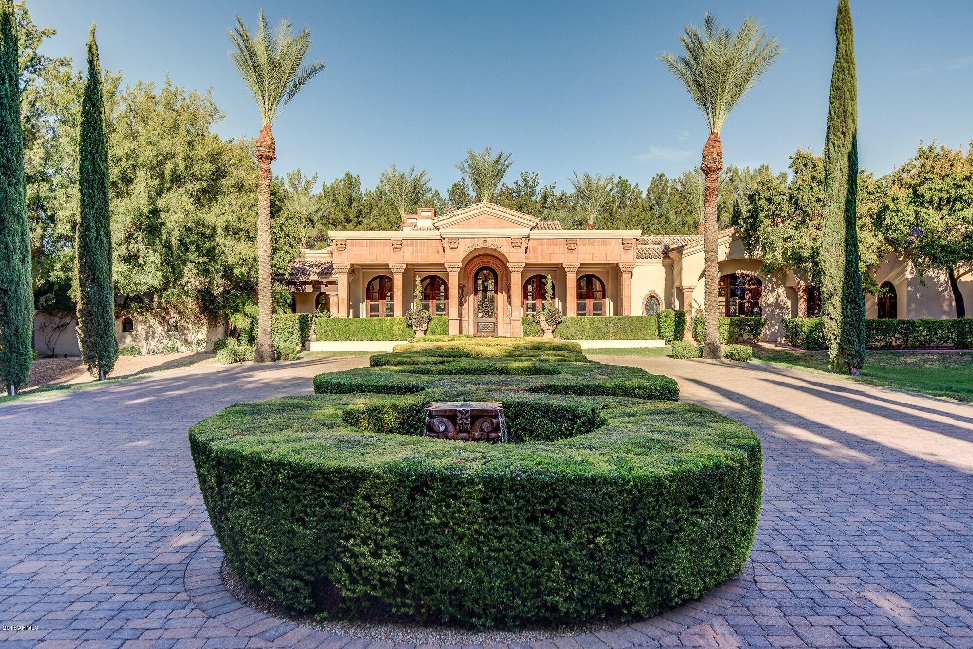 This elegant estate by luxury home builder Gietz Master Builders sits on 2 acres, featuring a stunning and unforgettable entrance. This extremely private, secure double-gated property includes a 6 car temp controlled garage, beautiful groin vault ceilings and hallway details, custom Shawn Stole doors/cabinetry, American Cherry hardwood floors, chef's double island kitchen, pocket doors which open the entire main living space for indoor-outdoor entertaining, poolside ramada with kitchen, master wing with expansive closets plus attached fitness room and spa room, oversized theatre attached to game room/bar and private guest suite with separate entrance.