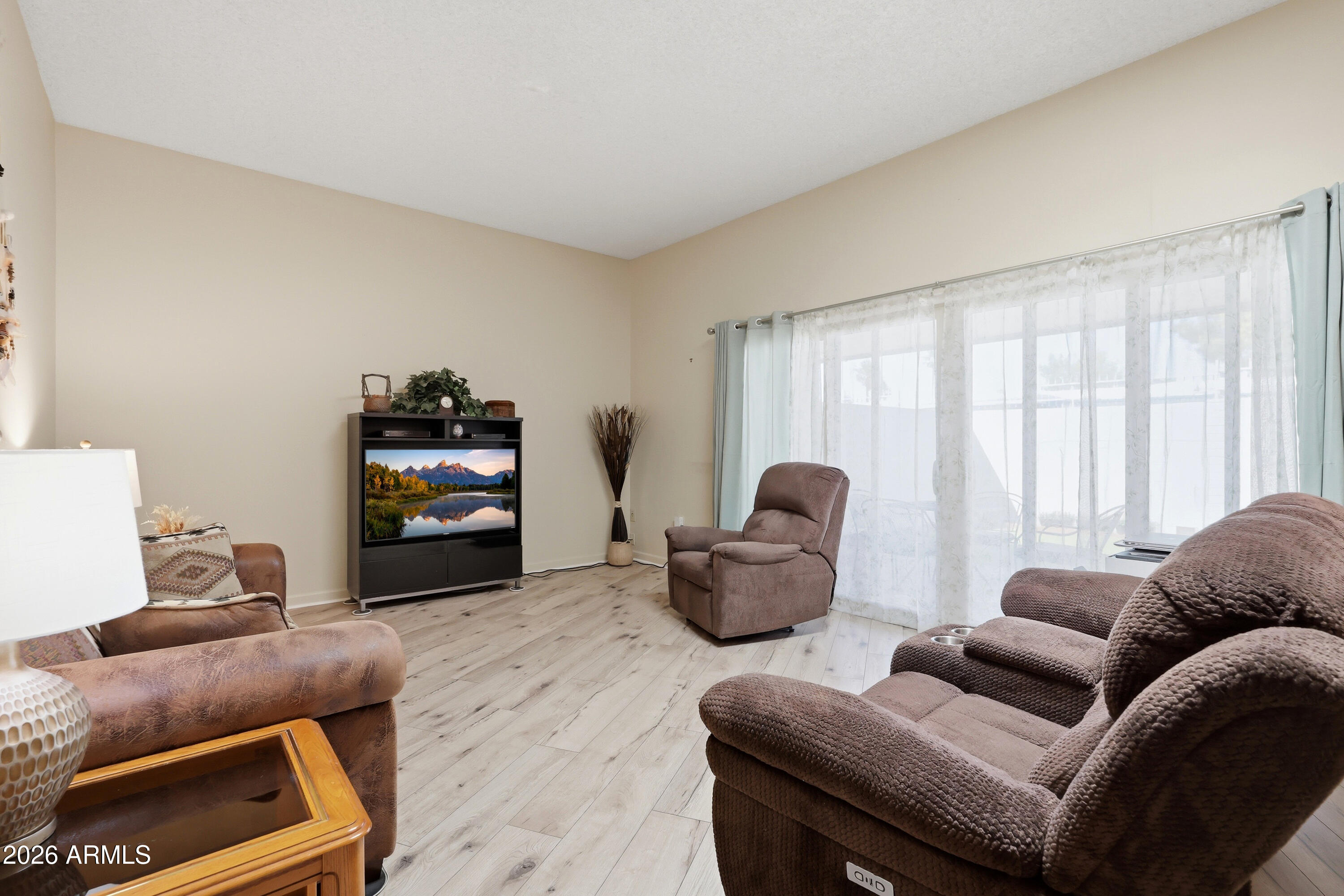 Bright, updated, and move-in ready condo/townhome in the heart of Sun City with thoughtful upgrades throughout. This inviting 2-bedroom, 2-bath home offers comfortable, low-maintenance living with new flooring, new windows, new sliding patio doors, and a remodeled kitchen and bathroom featuring modern finishes.
Natural light fills the home thanks to a solar tube that enhances the warm and welcoming atmosphere. The spacious layout includes an eat-in kitchen, generous bedrooms, ample storage, and a private covered patio perfect for relaxing or entertaining. all appliances included, a spacious, 1-car garage with built-in storage and laundry area, plus convenient access to Sun City's recreation centers, golf, pools, fitness facilities, clubs, shopping, dining, and medical services nearby. A great opportunity for buyers looking for an updated, move-in ready winter home or full-time residence in a vibrant active adult community.