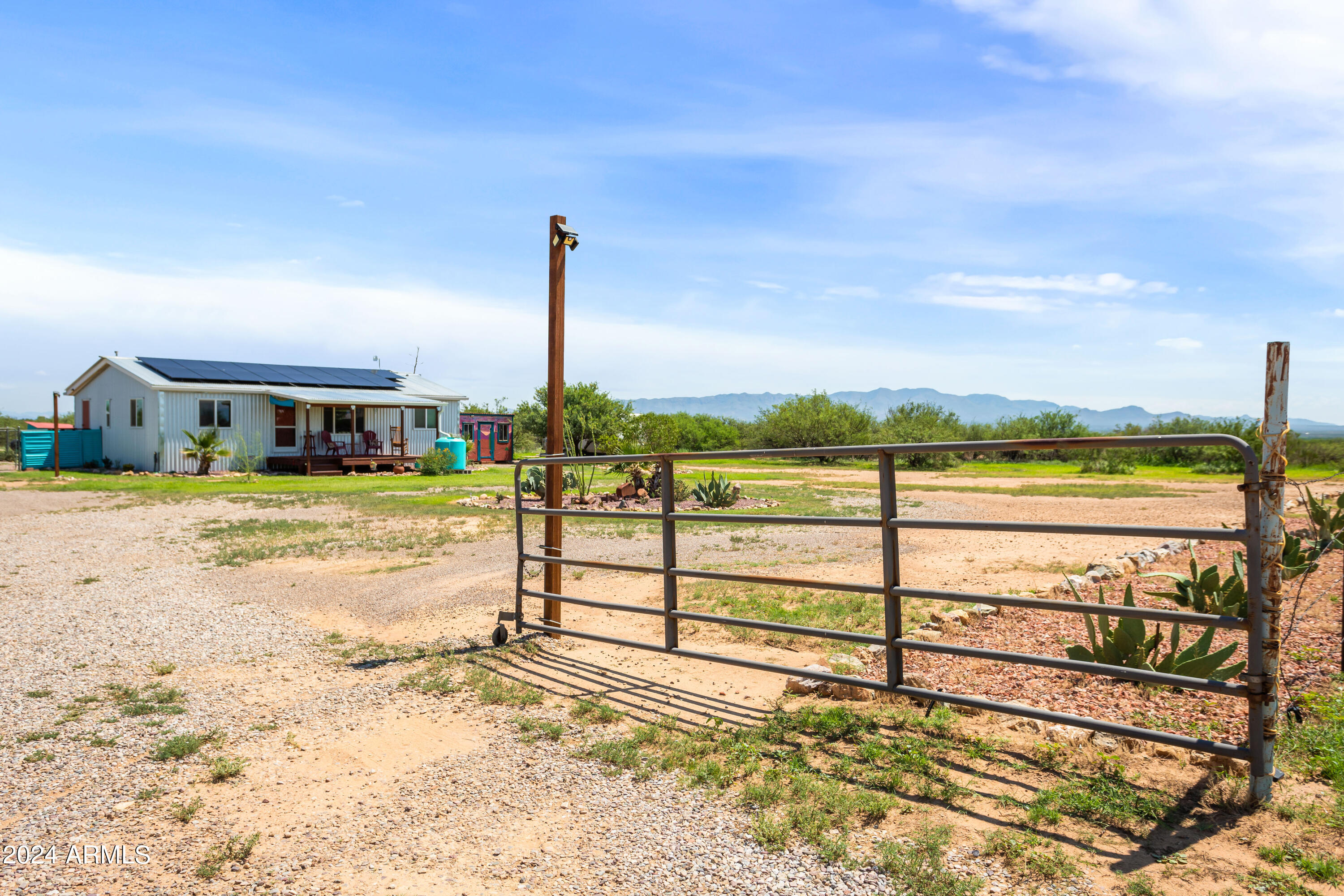 Welcome home to this beautiful 3-bedroom 2-bathroom house. Sitting on an amazing 20 acres you will be able to live with all the privacy and space needed for all your heart's desire. Stepping inside you will have a great open concept between the kitchen, dining area and living room as well as a split floor plan this home provides. This property is equipped with fencing for the full lot as well as a separate immediate backyard area. In the backyard you will find a spacious shed for your storage needs. The home has been thoughtfully updated and maintained to include metal siding and roof, solar panels (leased), new paint on the interior and exterior and so much more proving the pride of ownership and love. Short distance down a dirt road drive yourself to your new home!