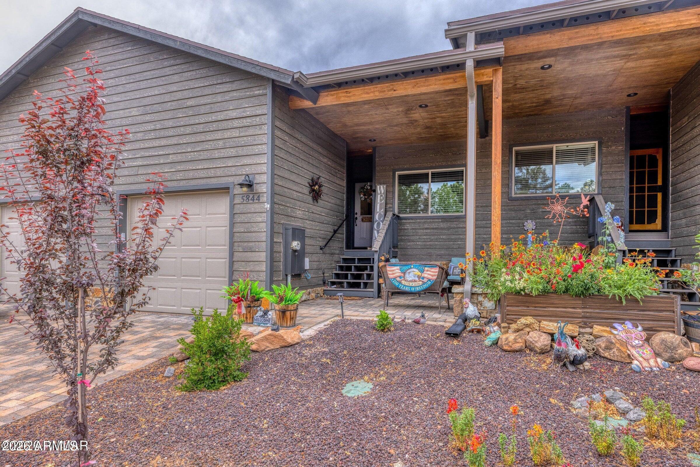 Fully Furnished and tucked among the tall pines in desirable Starlight Ridge, this gorgeous turnkey townhome offers the perfect blend of mountain charm and convenience. This beautifully maintained single-level home features 2 bedrooms, 2 baths, knotty alder cabinetry, granite countertops, and stainless steel appliances. The attached single-car garage features durable epoxy flooring, while the private backyard patio with pavers and lush turf is perfect for morning coffee or relaxing evenings beneath the pines. Conveniently located near shopping, dining, and amenities, yet peacefully nestled in a forest setting. The HOA adds exceptional value by covering blanket building insurance, landscaping, exterior maintenance, road maintenance, snow removal, and trash service for easy, carefree living.