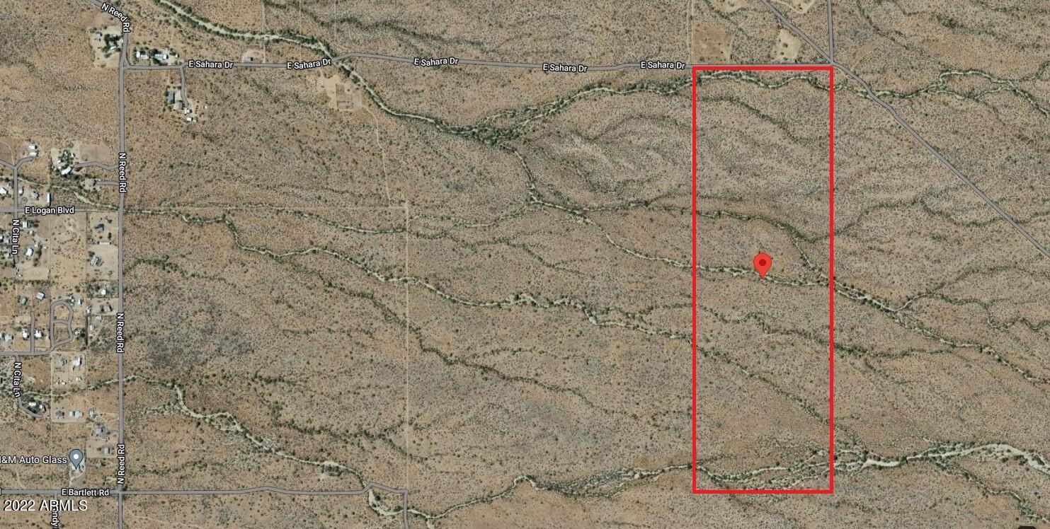 Here's your chance to buy a piece of prime property and a very rare offering. Escape from the bustle of a city to enjoy 300 days of blue sky & sunshine. Marvel at the incredible MOUNTAIN views, sunrises & sunsets, twinkling city lights, and dark, starry nights on this 119+ Acre paradise! Undisturbed Sonoran Desert at it's best! Beautiful outcroppings, dry washes, natural desert flora including saguaro, ocotillo, jojoba, many paddle and barrel cactus, unique desert lichen and numerous Mesquite and Palo Verde trees. A great investment for future growth maybe even an equestrian estate or residential development. Electric close to property.