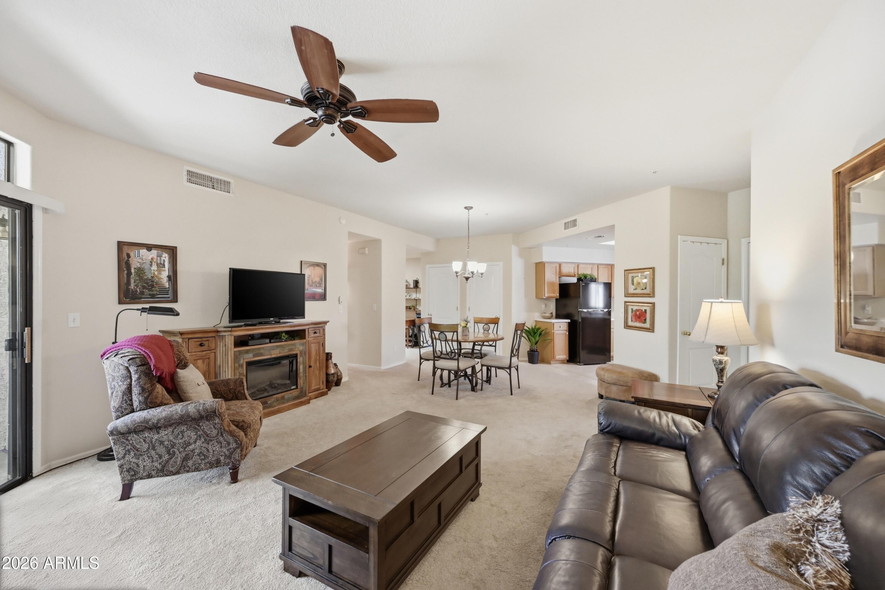 Cozy, convenient and immaculate home that comes furnished for your immediate move. Home offers ample and considerate layout, an inviting balcony, large storage space, and a light and bright environment. This gated 55+ community offers extra features like rentable storage garages on site, a luxurious pool and spa, fitness center, sports courts and a clubhouse. Home is also close to many of the areas fine golf courses so bring your rackets and clubs and enjoy all Arizona has to offer with this attractive turnkey living option.