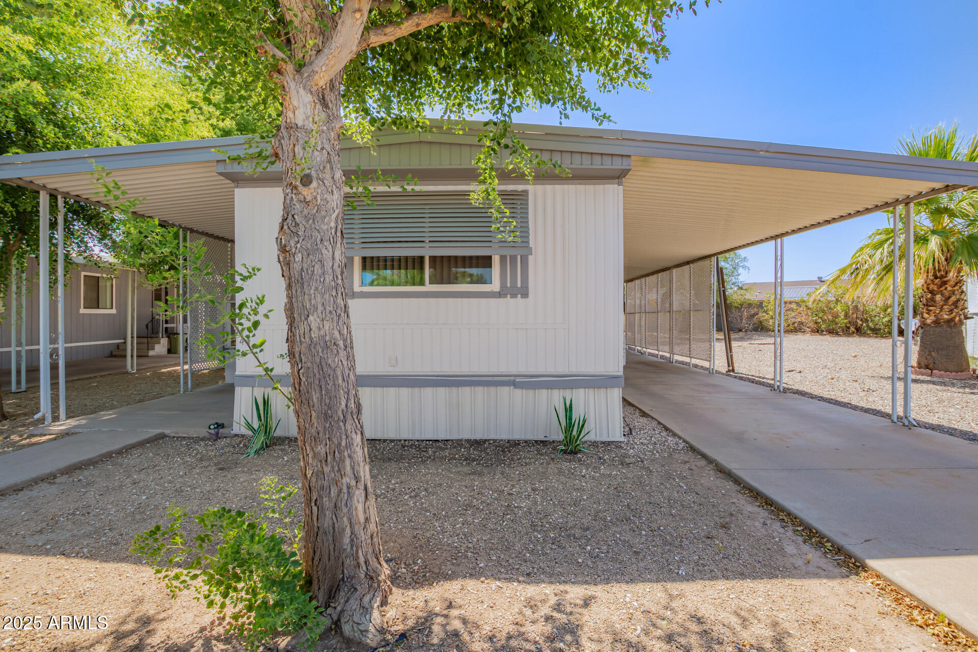 Welcome to easy living in this delightful 2-bedroom mobile home nestled in the 55+ community of Jadestone On Olive! Inside, you'll find brand new wood vinyl floors and a spacious living/dining area perfect for relaxing or entertaining. The cheerful kitchen features crisp white cabinetry, butcher block-style counters, and matching appliances that make meal prep a breeze. Relax in the main bedroom, which boasts its own private bathroom, giving you a comfy retreat at the end of the day. Enjoy your morning coffee or evening chats on the covered patio, and don't forget the handy shed for extra storage! The AC was replaced in 2022 and New vinyl windows in 2021. Enjoy this active 55+ community with a pool, spa, pickleball, billiards room and more. Super motivated seller.
