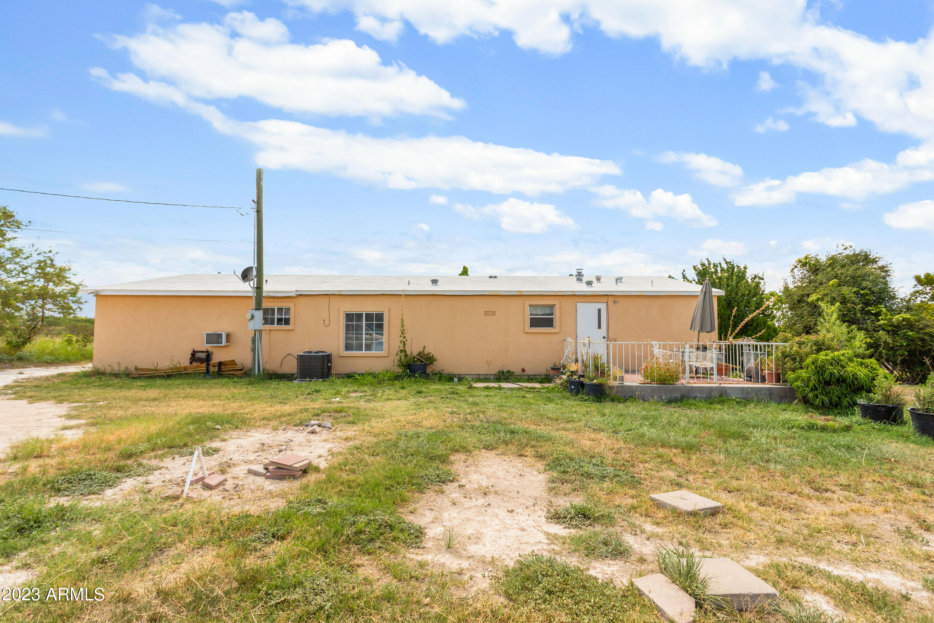 Serene living on over 4 acres in your new home with 4 bedrooms and 3 bathrooms. Private patio with amazing views of the surrounding mountains will have you in love with living outside during the great Arizona evenings. Property is fully fenced with a private gate to enter your dream home.