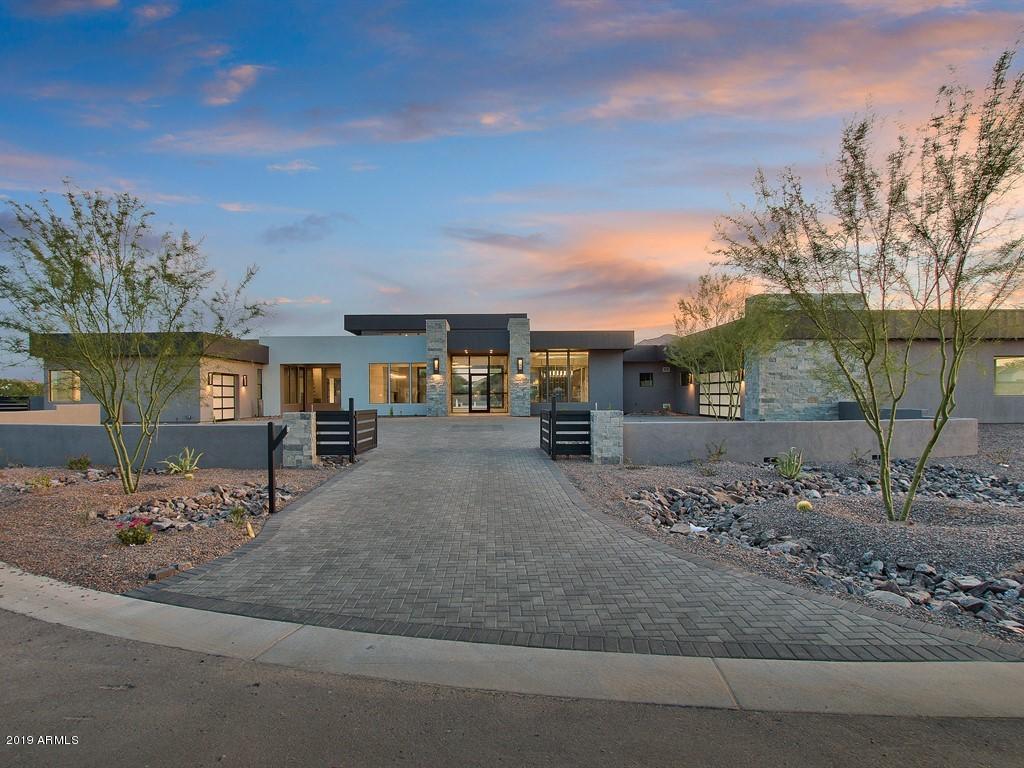 BRAND-NEW CUSTOM-BUILT HOME - JUST COMPLETED AND READY FOR MOVE-IN! 6442 LIVABLE SQUARE FOOTAGE WITH 3 BEDROOMS, 3.5 BATHROOMS PLUS AN ATTACHED 1 BED/BATH GUEST CASITA. THIS HIDDEN PARADISE IS LOCATED IN ONE OF THE MOST DESIRABLE AREAS OF PARADISE VALLEY, WITH INCREDIBLE VIEWS OF CAMELBACK MOUNTAIN IN THE BACKGROUND. OPEN SPACIOUS GREAT ROOM WITH BUILT-IN FIREPLACE, TEMPERED GLASS DOORS THAT OPEN ALL THE WAY UP TO THE COVERED PATIO AREA.  FORMAL DINING AREA AND BREAKFAST NOOK SURROUND THE OPEN KITCHEN AREA. CHEF'S DREAM KITCHEN THAT IS SPACIOUS WITH PLENTY ROOM FOR ENTERTAINING. ALL STAINLESS-STEEL APPLIANCES INCLUDING A 6-BURNER GAS RANGE WITH GRIDDLE, DOUBLE WALL OVENS, WARMING DRAWER, SUB-ZERO FRIDGE. LARGE KITCHEN ISLAND WITH EAT-UP BAR SEATING. FULL STANDING WINE RACK DISPLAY SURROUNDED BY TEMPERED GLASS. OWNER'S SUITE WITH ONE OF THE LARGEST WALK-IN CLOSETS IMAGINABLE! BUILT-IN FIREPLACE AND SEPARATE EXIT OUT TO YOUR OWN PRIVATE PATIO. OWNER'S BATH HAS DUAL SINK VANITIES, WHIRLPOOL TUB AND WALK-IN SHOWER OPEN ON BOTH SIDES, PRIVATE TOILET ROOM WITH BIDET. BONUS AREA OUTSIDE THE GUEST BEDROOMS THAT IS GREAT FOR A PLAY AREA FOR THE KIDDOS. BOTH GUEST BEDROOMS HAVE WALK-IN CLOSETS AND EN-SUITE BATHS. LAUNDRY AREA WITH TONS OF STORAGE SPACE AND LAUNDRY TUB. ADDITIONAL POWDER BATH AND A PRIVATE OFFICE/DEN. AN ATTACHED GUEST CASITA WITH A SEPARATE ENTRANCE FROM THE OUTSIDE AND A ONE CAR GARAGE. LIVING AREA WITH UNDER COUNTER REFRIGERATOR, WET-BAR SINK AND BUILT-IN IRONING BOARD. BEDROOM WITH CLOSET AND BATHROOM WITH DUAL SINK VANITY AND TUB/SHOWER COMBO. THE BACKYARD WILL BE DECKED OUT WITH A RESORT-STYLE SWIMMING POOL AND SPA. OVERSIZED RAMADA WITH BUILT-IN BBQ, BAR SEATING AND SINK. LOTS OF LUSH DESERT LANDSCAPING, ALONG WITH SILVER TRAVERTINE TILE. HOME IS WITHIN WALKING DISTANCE TO THE NEW RITZ CARLTON RESORT, SHOPPING, GOLF, THE FINEST OF RESTAURANTS AND JUST MINUTES FROM DOWNTOWN PHOENIX AND SCOTTSDALE. CALL TODAY FOR YOUR PRIVATE TOUR!
