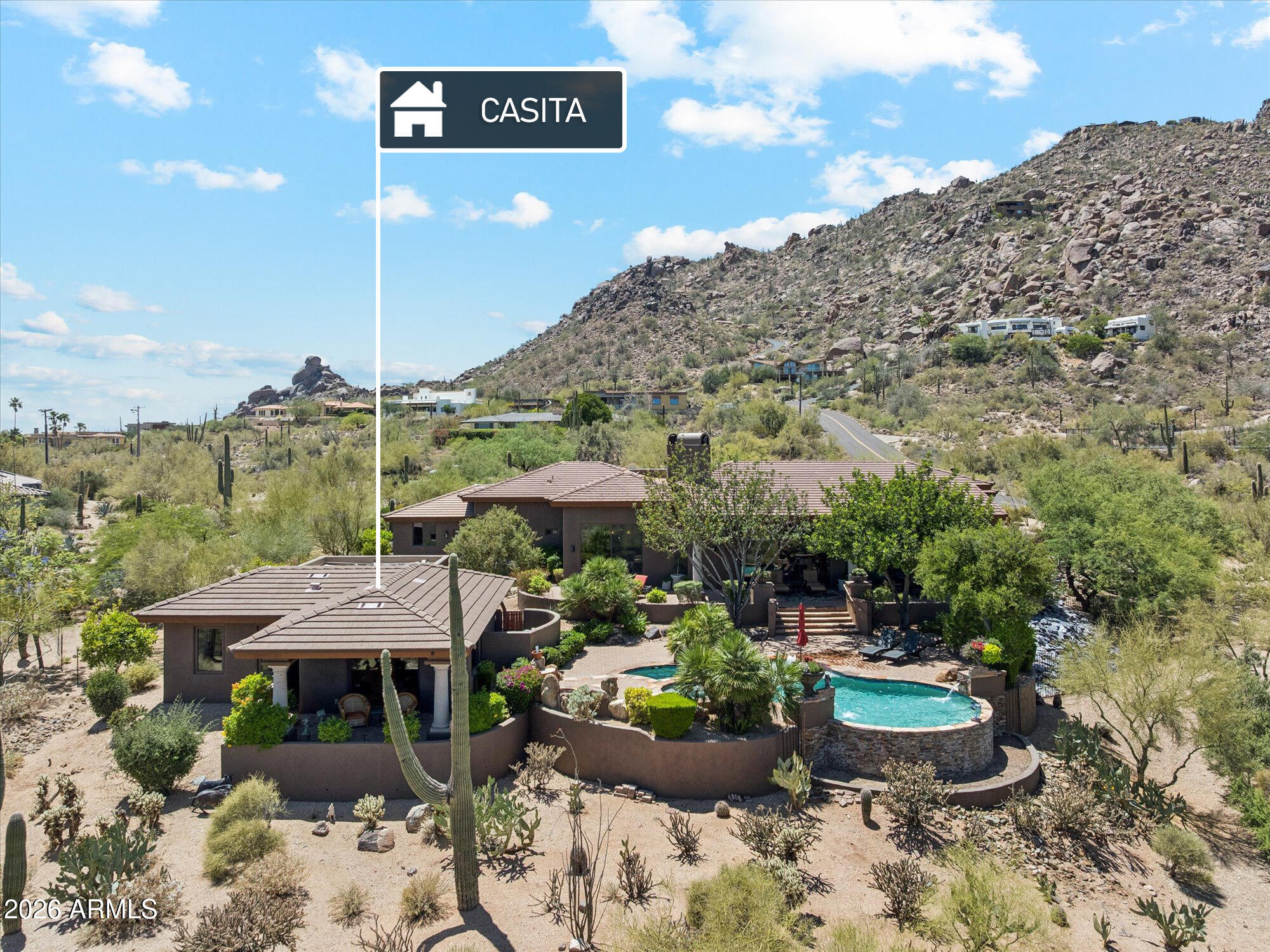 Fabulous Views Front, Back and every window from this Custom Mountainside Home!  Long paver driveway leads to gated courtyard with fountain and stunning boulder views on Black Mountain! Enter into Wonderful Great room surrounded by high windows and sliding panel doors with awesome views and everything is automated from the automatic blinds to custom lighting! Quality is unmatched with Polished Marble Floors & coffered and beamed ceilings!
Gourmet Kitchen with 42'' alder wood cabinets, huge island with 5 burner gas cook  top, New Taj Ma-hal Quartsite counters and stainless steel  appliances!  Split Primary suite with stunning views,  huge his and her walk in Classy Closets, Vanities with Quartsite tops, large walk in shower & new free standing soaking tub! Beautiful Pool and Spa & Casita House with living room, full kitchen, large bedroom and bath + it's own washer /dryer!