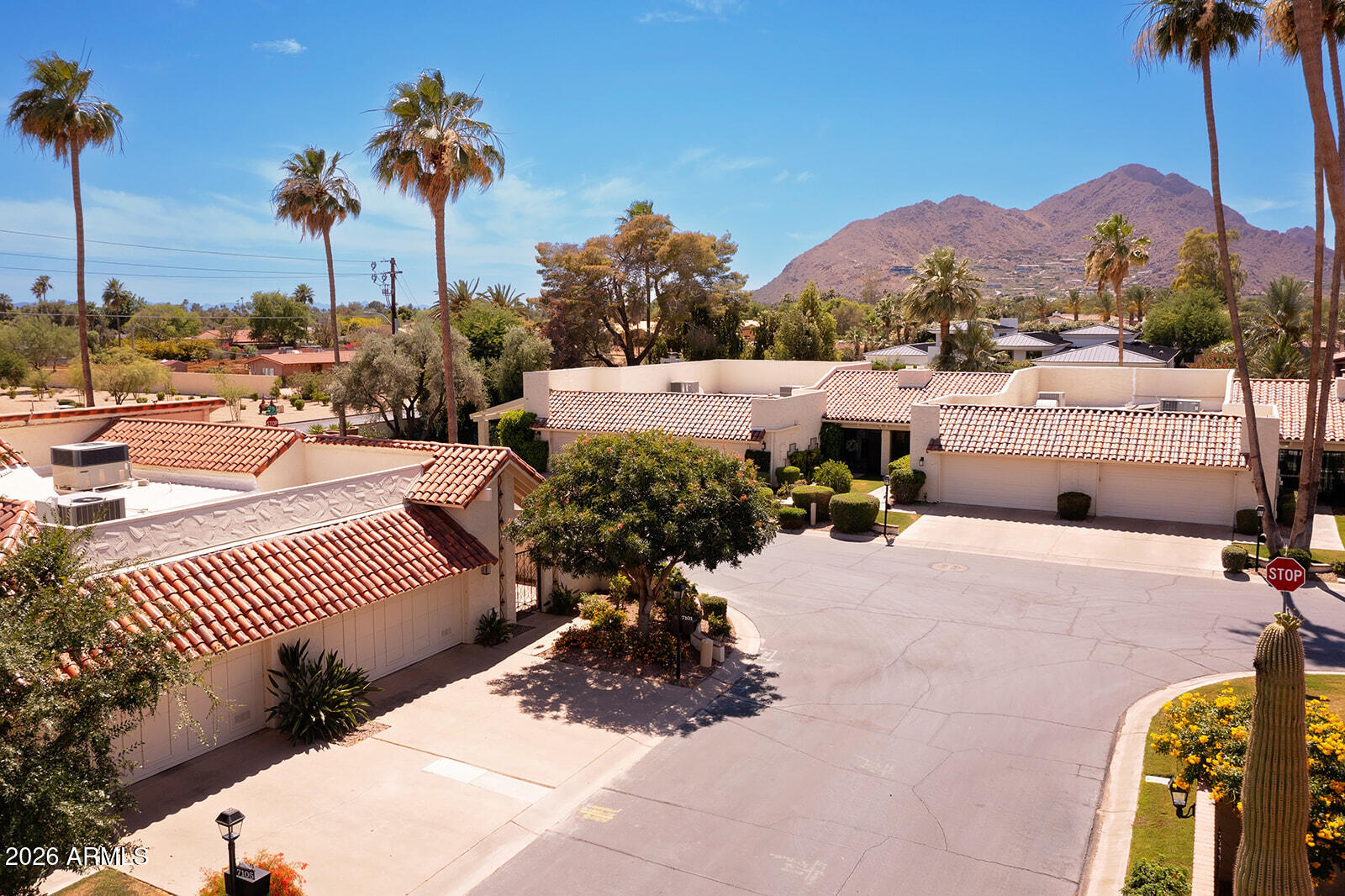 Great price for PV! Nestled in the most coveted ZIP code of 85253 in Paradise Valley, this charming home is part of a very special, impeccably kept community where lush green lawns, mature trees, and private courtyards line the quiet streets. The neighborhood is a true hidden gem, complete with a sparkling pool and hot tub, surrounded by tall swaying palms and mountain views, plus a grand club house with a fitness center, billiards room, and kitchen for social gatherings. This home is completely updated, light bright and airy, current and tastefully done.  Beautiful real wood features through out, INCLUDING ALL SOLID WOOD DOORS, built ins and custom touches make this gem stand out. Note the stunning kitchen with gorgeous Quartz counters, intricate back splash and the luxury of a pot filler over the stove. CAMELBACK MOUNTAIN VIEW from your kitchen window and back patio! Amazing master bathroom that you must walk in to understand!  The 2 rain heads, all the other water features you usually only see in higher price range homes. All this is in the most low maintenance package! Enjoy an impeccable yard without having to do it yourself! Lounge at the peaceful pool without having to maintain it all yourself! Leaving you with more freedom to relax and enjoy all the great dining, shopping, golfing and hiking that this very special location has to offer! Come see for yourself and feel the difference a community like Villa De Fuente makes.