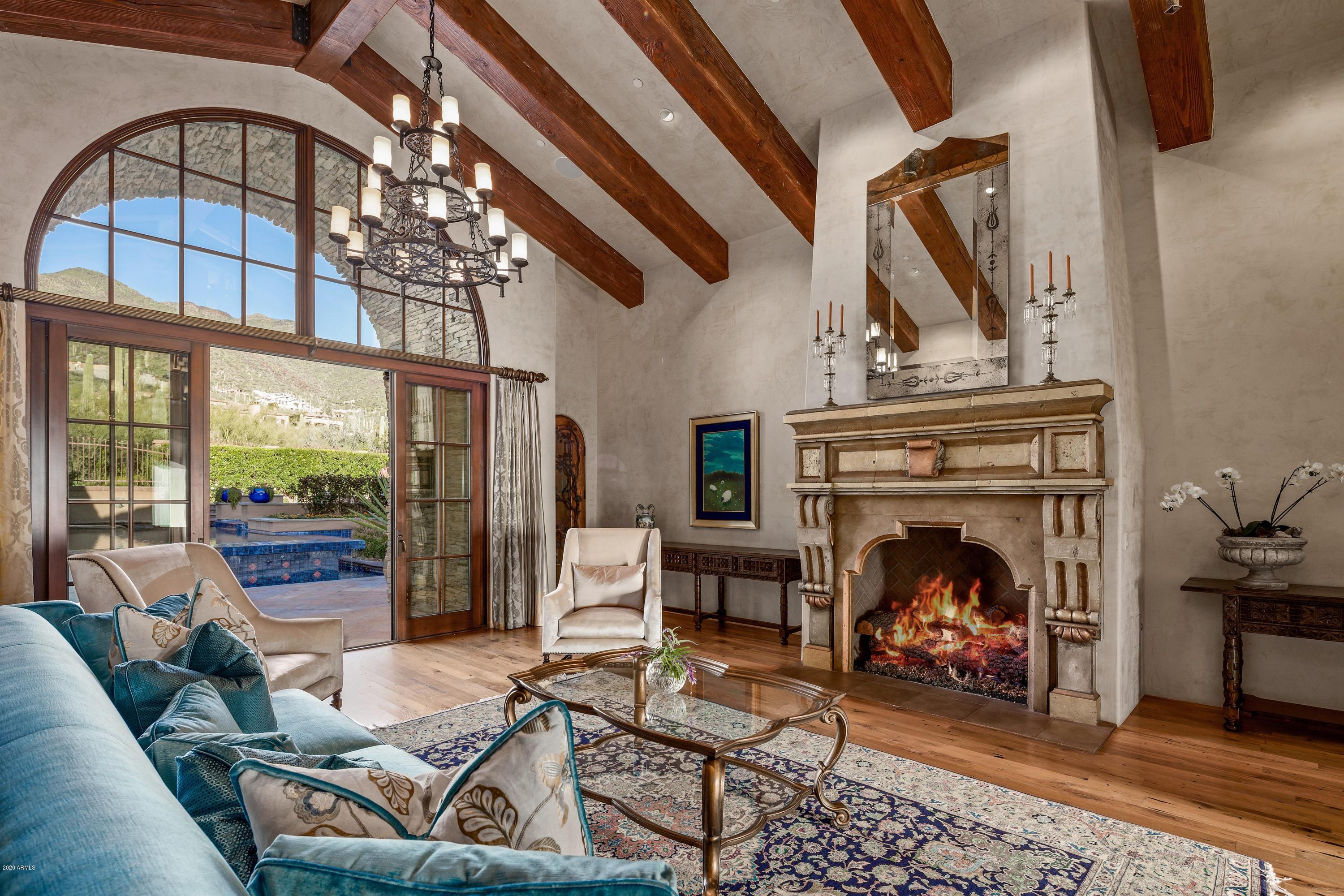 Elegant and timeless ~  Silverleaf Upper Canyon. This home is a singular work of art with classic European  influences and unobstructed mountain views from every single room. City lights sparkle from the rooftop lounge and total privacy is enjoyed from the posh pool patios seated before the breathtaking ranges that rise in front of you. The carefully curated floor plan and classic architecture offers light filled luminous living spaces with hearth and home generosity. Detached poolside two room garden casita extends deluxe independent living for guests. Cerulean blue waterfall pool and duet spas join the covered cabana, outdoor kitchen & dining with wood fired pizza oven and firepit seating for 12. The lovliest gardens of roses and star jasmine enchant throughout the entire property. Camelback Mountain views while city lights dazzle below. Finishes include Maganese Imported Saltillo, reclaimed oak wood floors & Canterra stone. Please see features sheet in Documents Section.