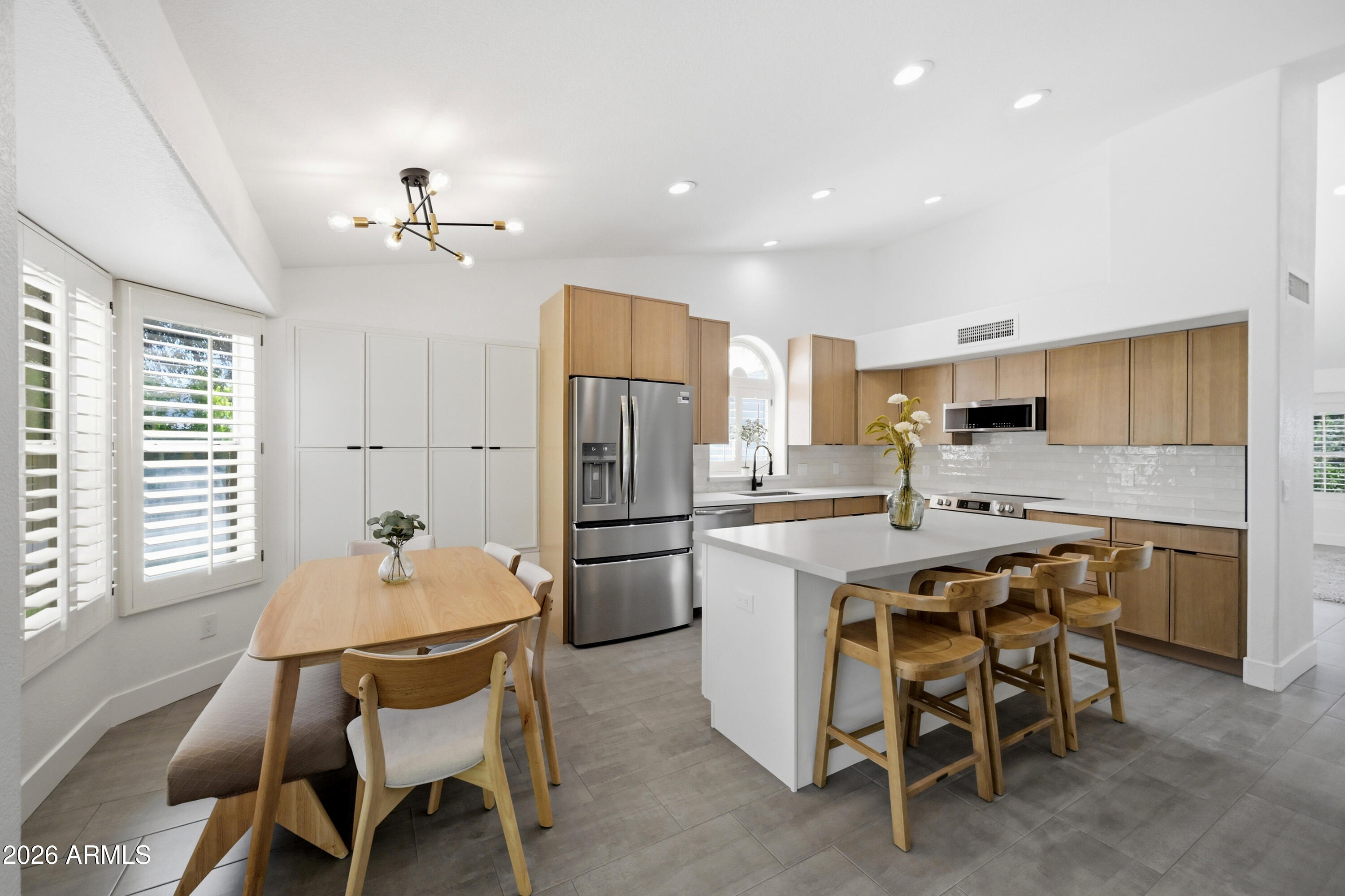 Multigenerational living under $1M in Scottsdale is a rare find--especially in the sought-after Kierland/PV Mall area. This fully remodeled 2,012 sq ft home sits on nearly a quarter-acre and offers 4 bedrooms and 3 bathrooms, including an attached mother-in-law suite with its own full kitchen. The suite can be walled off for added privacy, ideal for extended family or rental potential. Enjoy two RV gates and an extended paver driveway for ample parking. Inside features updated bathrooms, a modern kitchen, new flooring, and fresh paint inside and out. Spacious layout, oversized lot, and prime location near Kierland Commons and Scottsdale Quarter complete this exceptional home.