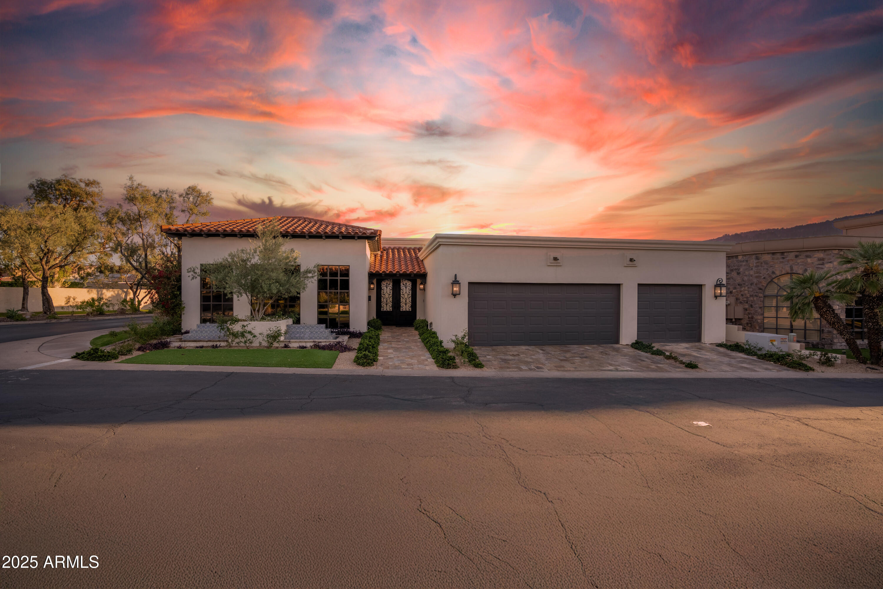 Welcome to 2421 E Montebello Ave, an extraordinary 3-bedroom residence with an office and 5 bathrooms, spanning 3973sq feet of lavish living space in the prestigious guard-gated community of Biltmore Taliverde. This exquisite home is nestled adjacent to the renowned Arizona Biltmore, a Waldorf Astoria Resort & Golf Club, and boasts captivating views of the iconic Wrigley Mansion - truly embodying the essence of the American Dream. Offered at $3,250,000, this residence boasts the epitome of opulent finishes, featuring a private spa retreat complete with a sauna, light therapy, steam shower, cold plunge, and jacuzzi, presenting an unrivaled level of luxury where no expense has been spared. As you step through the grand iron entry door, you are greeted by a world of sophistication and style within this meticulously upgraded designer home. Striking architectural details include exquisite beam work, soaring vaulted ceilings, arched openings, rich hardwood floors, and custom Italian tile that graces the space. The living area seamlessly extends to a breathtaking courtyard adorned with lush landscaping, scabos travertine tile, huge fire pit and a glistening pool, connected by expansive multi-slide glass doors, creating an ambiance of openness and tranquility. Two limestone-surround fireplaces enhance the atmosphere with elegance and warmth.
For culinary enthusiasts, the chef's kitchen is a true delight, featuring top-of-the-line Wolf appliances, including a built-in espresso machine, induction cooktop, drawer microwave, Cove dishwasher, Scotsman nugget ice maker, Signature beverage fridge and a custom iron hood range. A Sub-Zero fridge and freezer, and stunning Taj Mahal leathered quartzite countertops complete this high-end culinary haven. This is more than just a residence; it's a masterpiece of luxury living in one of Phoenix's most prestigious communities. See document tab for a list of upgrades including a complete roof tile and underlayment replacement, 4 new Trane AC units and more. *As Seen on American Dream TV*