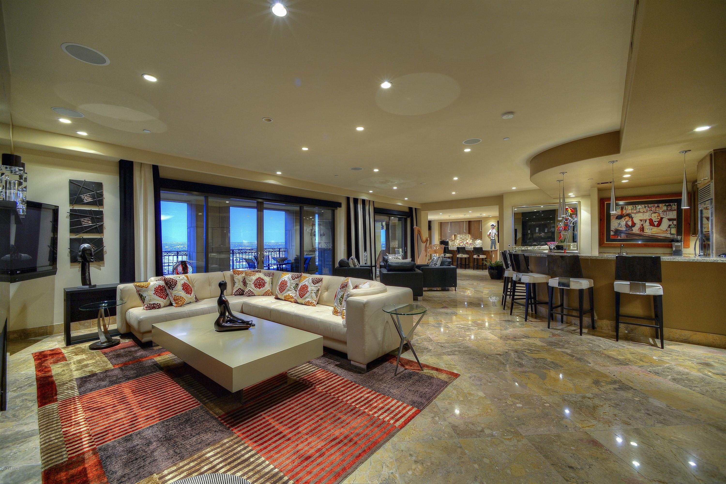Extraordinary Penthouse with amazing views!  This exceptional 3 bedroom, 3.5 bathroom, 3,940 sqft condo at the luxurious, and ideally located, Scottsdale Waterfront Residences, has an expansive open floor plan, two large balconies, a theater room, gourmet kitchen, and a beautiful bar area.  The prestigious Scottsdale Waterfront Residences offers residents 24-hour security, concierge & valet services, a fitness center, massage rooms, a breathtaking rooftop pool, spa, and a club room with fireplaces, reading nooks, and areas to relax and entertain, all within a comfortable walking distance to Fashion Square Mall, Old Town Scottsdale, and the many fine restaurants, boutiques, and art galleries.