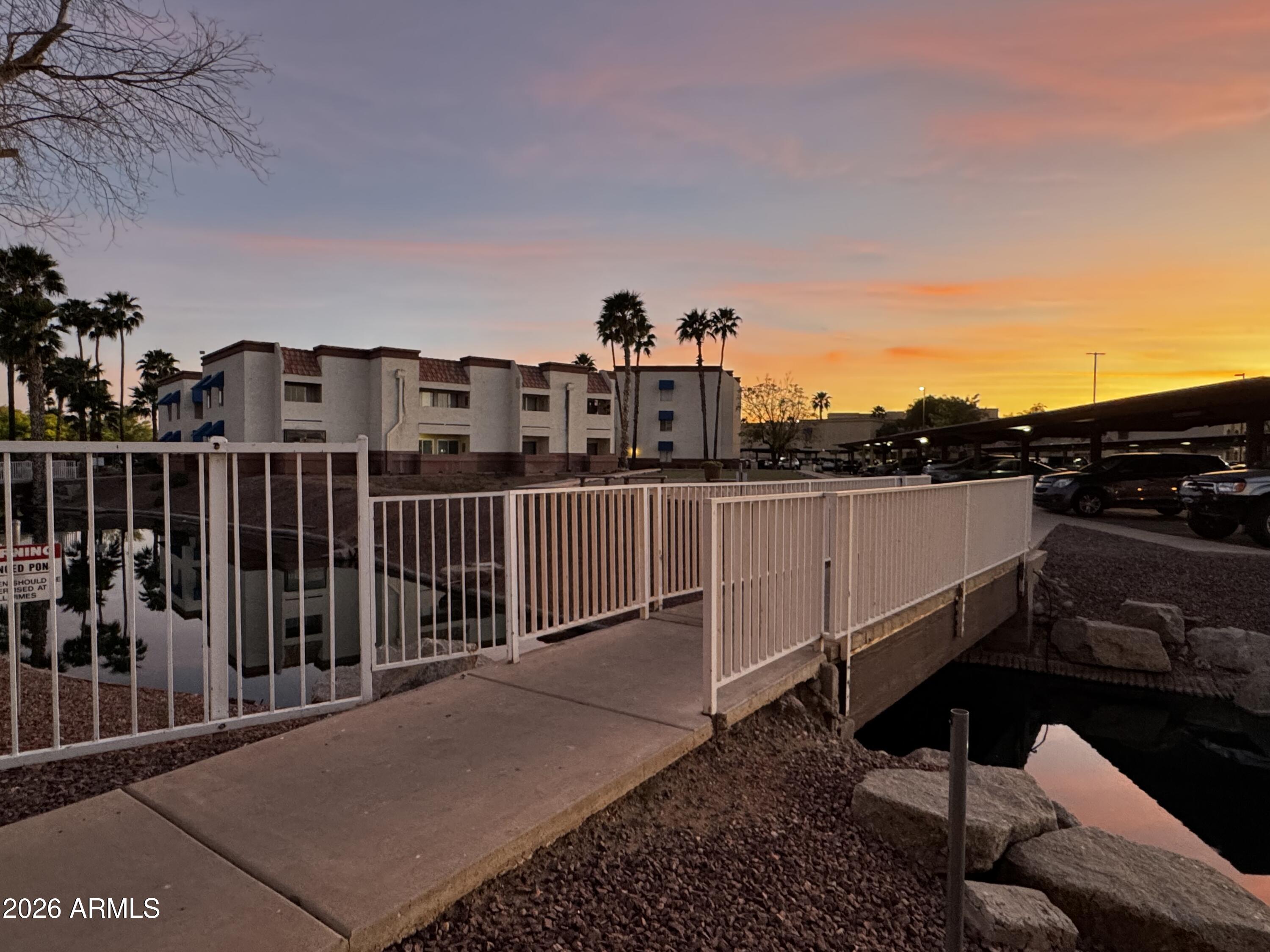 Ground-level unit in The Cliffs Condominium community featuring a large enclosed balcony, providing additional living space and year-round usability.  The unit offers a functional layout with good natural light and presents an excellent opportunity to personalize or enhance over time. Currently tenant-occupied, providing immediate income and cash flow potential, ideal for investors. Located near the parking area with wheelchair-accessible features for added convenience. Easy access to Loop 303 and close to shopping, dining, and everyday amenities, Conveniently located with
easy access to Loop 303 and just a short drive to the rapidly growing North Valley tech corridor, including major semiconductor developments and employment centers. assigned covered parking !
