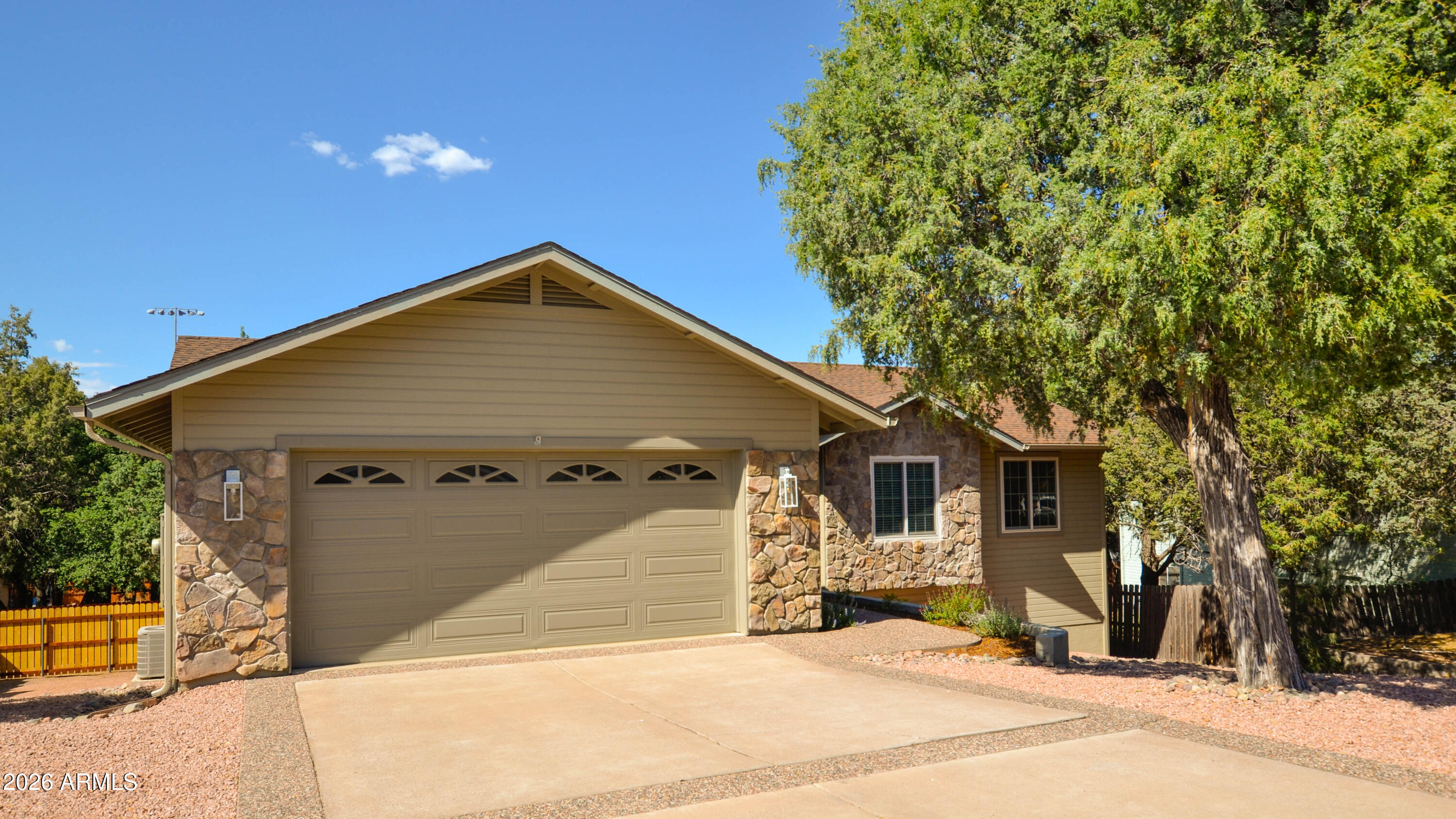 Located in the highly desirable Trailwood neighborhood, one of Payson's premier walkable communities, this beautifully updated 4-bedroom, 3-bath home (Easy To Ad The 5th Bedroom) also features a private dedicated home office. This home offers exceptional comfort, quality, and convenience. Just minutes from shopping, medical facilities, dining, and other city services, the property is also within walking distance of Rumsey Park and the Payson Public Library. The home showcases high-end custom cabinetry throughout along with genuine engineered hardwood flooring -- not laminate -- offering both durability and elegance. Recent renovations include fresh interior and exterior paint, plus brand-new carpet in all bedrooms. The roof has also been recently replaced, providing added peace of mind. The spacious main level features the primary master suite with an updated bath complete with new quartz countertops and double sinks, along with two additional bedrooms and the private office. With virtually no steps required to access the main floor, the home offers excellent accessibility and everyday convenience. The inviting great room centers around a cozy gas fireplace, perfect for cool mountain evenings. Off the dining area, an arcadia door with side ventilation opens to a covered upper deck -- ideal for barbecuing, entertaining, or simply relaxing and enjoying Payson's cool summer nights. The kitchen is equipped with stainless steel appliances, including a brand-new flat-top range. Downstairs, the expansive walkout lower level offers incredible flexibility with two additional bedrooms, a bathroom, and a large multi-purpose space with direct access to the fenced backyard. A pellet stove in this level can virtually heat the entire home. A large walk-in crawl space provides abundant storage. As an added bonus, the seller is including a 5-Star Plus Home Warranty from Home Guard Home Warranty. This move-in-ready home combines thoughtful updates, flexible living space, and an unbeatable location.