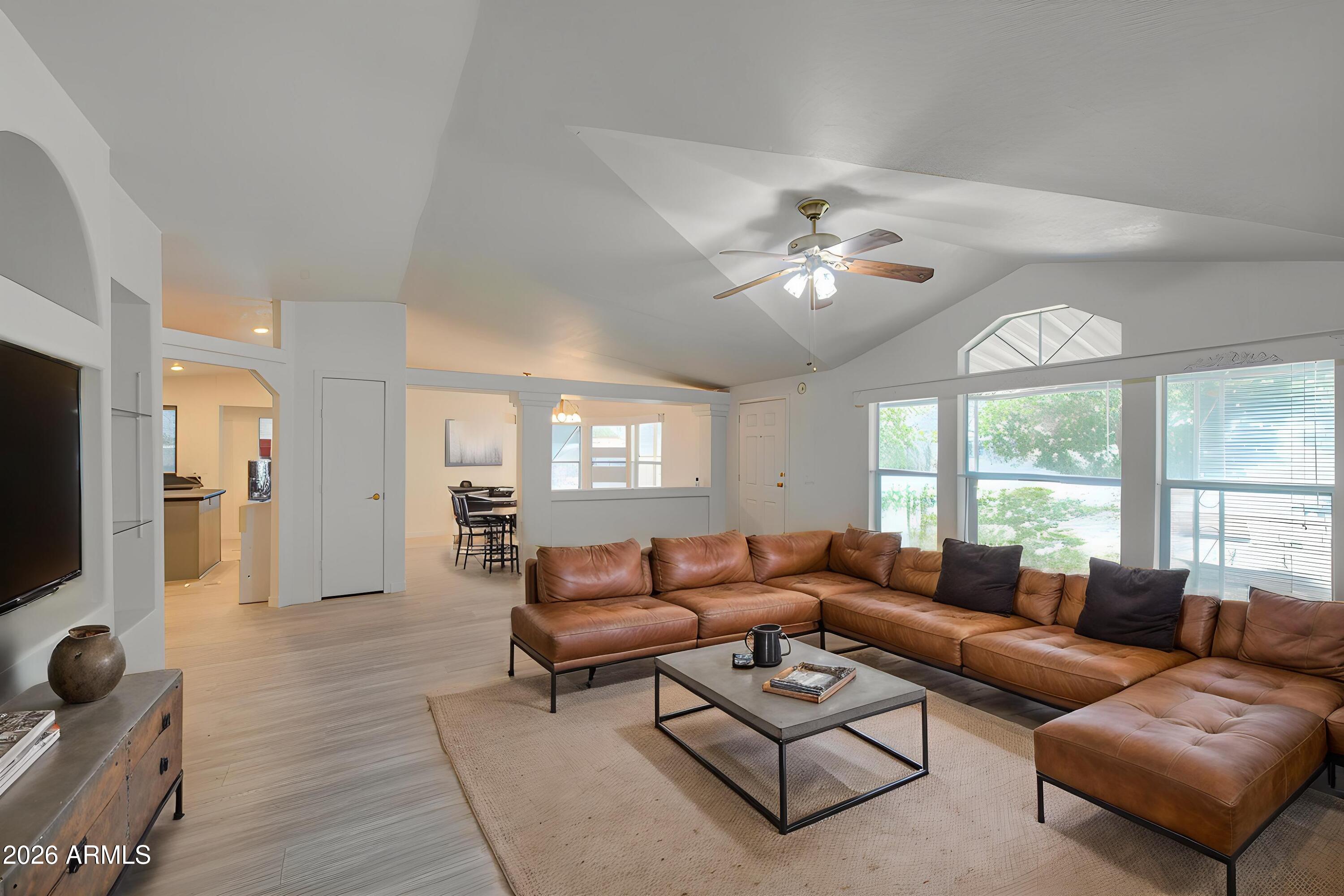 Move-in ready and beautifully remodeled, this spacious 3-bedroom, 2-bath home offers 1,736 sq. ft. of bright, open living space designed for today's lifestyle. The inviting open-concept floor plan is enhanced by fresh interior and exterior paint, luxury vinyl plank flooring throughout, recessed lighting, dual-pane windows, upgraded ceiling fans, a new A/C system with air handler, Wi-Fi thermostat, and a new tankless water heater.  The beautifully updated chef's kitchen features refinished cabinetry, new stainless steel appliances, including a refrigerator, and generous counter and storage space--perfect for everyday living and entertaining. Both bathrooms have been tastefully renovated with new vanities, fixtures, and toilets, creating a fresh, modern feel.  Additional highlights include: Two covered carports, two extra parking spaces, a large utility/storage room, multiple storage closets, 8 fruit trees, 4 built in planters, and a 360-degree wraparound sidewalk for easy access around the home. The home is permanently anchored to the ground and includes snap-on exterior window shade covers for added comfort and energy efficiency.  Ideally located within walking distance of highly rated schools and just minutes from freeway access, shopping, restaurants, and everyday conveniences, this turnkey home combines quality updates, generous space, and an exceptional location. Don't miss this outstanding opportunity!