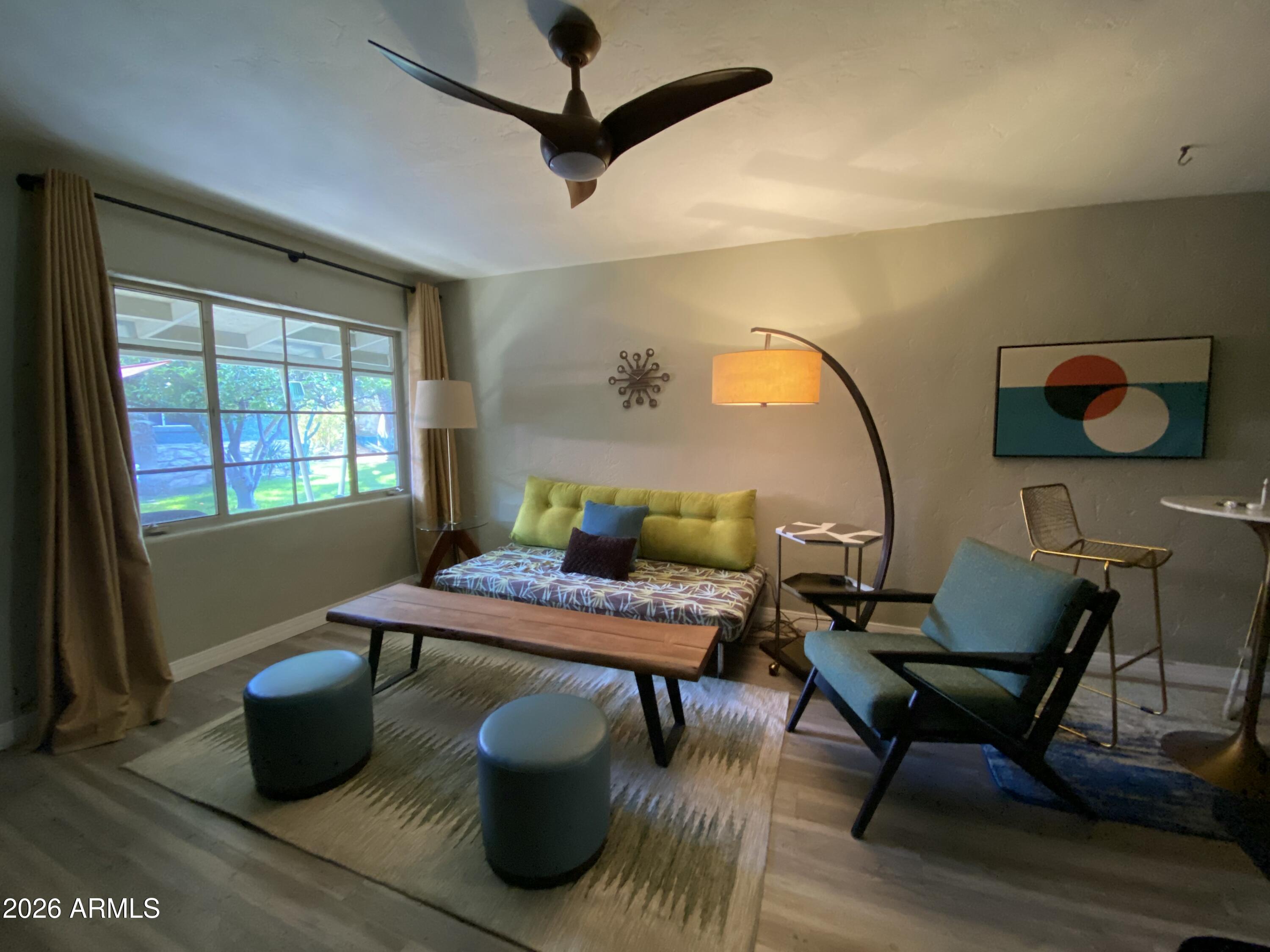 Very charming and quiet mid-century apartment community in midtown Phoenix situated just north of the Phoenix country club features a garden style four-unit building and a beautiful two-bedroom home (separate listing) surrounding a lush green community courtyard! The apartment units have been meticulously upgraded with beautiful flooring, tiling, paint, appliances, ceiling fans and lighting. An array of improvements and enhancements on this stunning property have created an environment where tenants typically remain for a long time! Ideal set-up for someone who wants to reside in the mid-century home while renting the units out. Or perfect AirBnB! This one's truly a gem in a fantastic location near light rail, Biltmore and downtown!