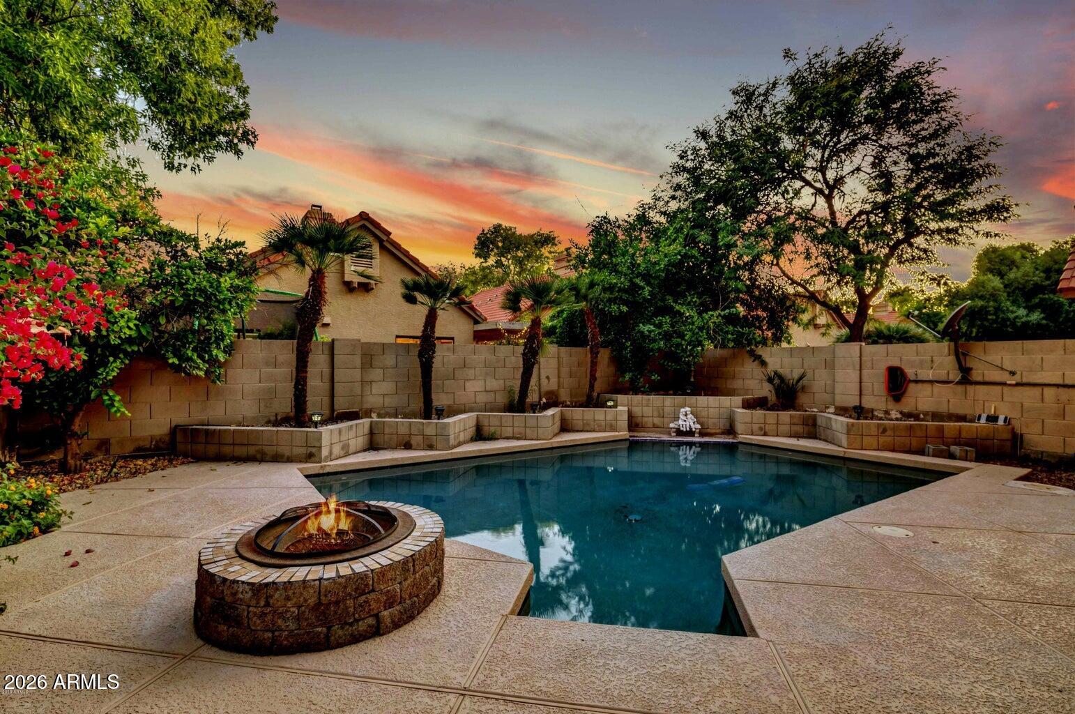 The ultimate Chandler lifestyle awaits!
Location, location, location! Nestled in the highly coveted Dawn community, close to shopping, fine dining, great schools, Sky Harbor airport & easy freeway access, this beautifully modernized showpiece sits right around the corner from the sprawling Desert Breeze Park. Step inside to an absolute entertainer's dream, where soaring vaulted ceilings amplify the bright, airy formal living & family spaces. The downstairs level gleams with rich laminate wood flooring & durable ceramic tile, beautifully tied together by a fresh, contemporary two-tone paint palette. At the heart of the home is a chef-inspired kitchen packing massive visual punch outfitted with upgraded raised-panel cabinetry, premium granite slab countertops, a stone tile backsplash & slee stainless steel appliances. The expansive pass-through window keeps you fully connected to your guests in the living area while you prep. Head upstairs via the dramatic, upgraded wrought-iron staircase to find a versatile open loft & a smart split-bedroom layout. The private primary retreat feels like a boutique hotel, boasting a dual-sink vanity, a deep garden soaking tub & a massive walk-in closet complete with high-end custom built-in shelving. Step out back into your own personal desert oasis. Whether you are taking a dip in the sparkling Pebble-Tec pool, soak in the above ground jacuzzi tub or sharing stories around the built-in fire pit on a cool desert evening, this backyard is built for unforgettable memories. Don't miss out on this absolute gem!