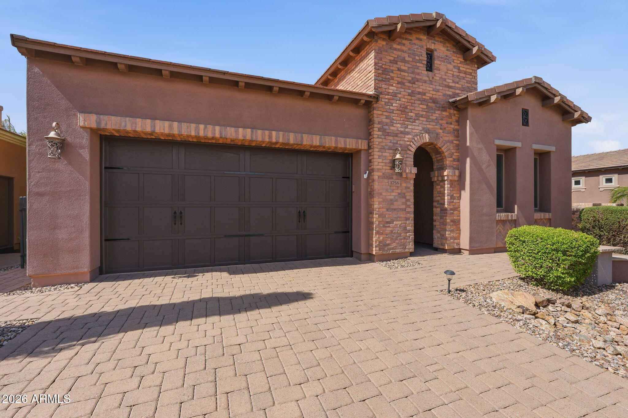 Fresh opportunity to own this beautifully upgraded home in Encanterra! Designed for effortless Arizona living, this meticulously maintained residence features a newer A/C (2023), tankless water heater, and paid-in-full solar for outstanding energy efficiency. Inside, you'll find elegant stone accents, architectural archways, staggered cabinetry, and a cozy gas fireplace that creates a warm, inviting atmosphere. The private primary suite offers direct access to your backyard retreat, where a pergola-covered hot tub, dramatic water feature with a fire element, mechanical screens, and serene greenbelt views create the ultimate setting for relaxation or entertaining. Every detail has been thoughtfully designed to deliver comfort, beauty, and resort-style living.