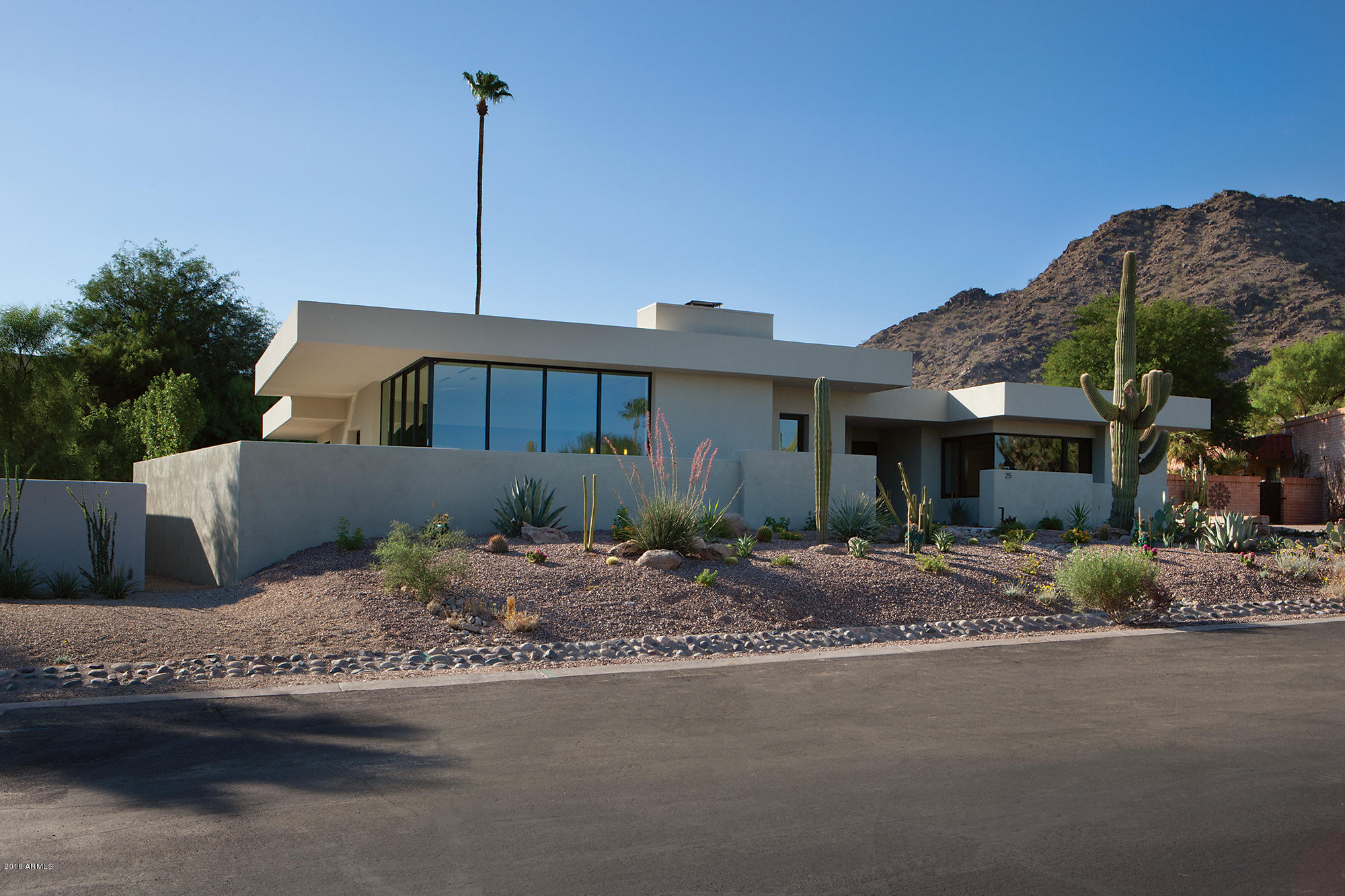PV Contemporary Master Piece. This Drewett Works (CP Drewett) home was designed to capture the most stunning full views of Camelback Mountain from almost every room. Control 4 Technology brings this home to life with approx. 3,600 sq.ft. Steel Beam and 2x6 construction. 3 bedrooms, 3.5 baths. electric shades,  18' Island in Great Room. 32' of 12' pocketing doors for indoor / outdoor entertaining.  Kitchen is equipped with Wolfe and Sub Zero, Hansgrohe fixtures, European wide plank wood flooring T/O. Quartz counter tops, Custom Cabinetry, Porcelain tile, whole house filtration,3 Trane HVAC units, 2 Navien Energy Star Tankless recirculating Hot water,Comm. grade doors and windows. Enjoy Room Service from the CI Lincoln Steak House and Rita's. Car and laundry Srv. Spa and more.