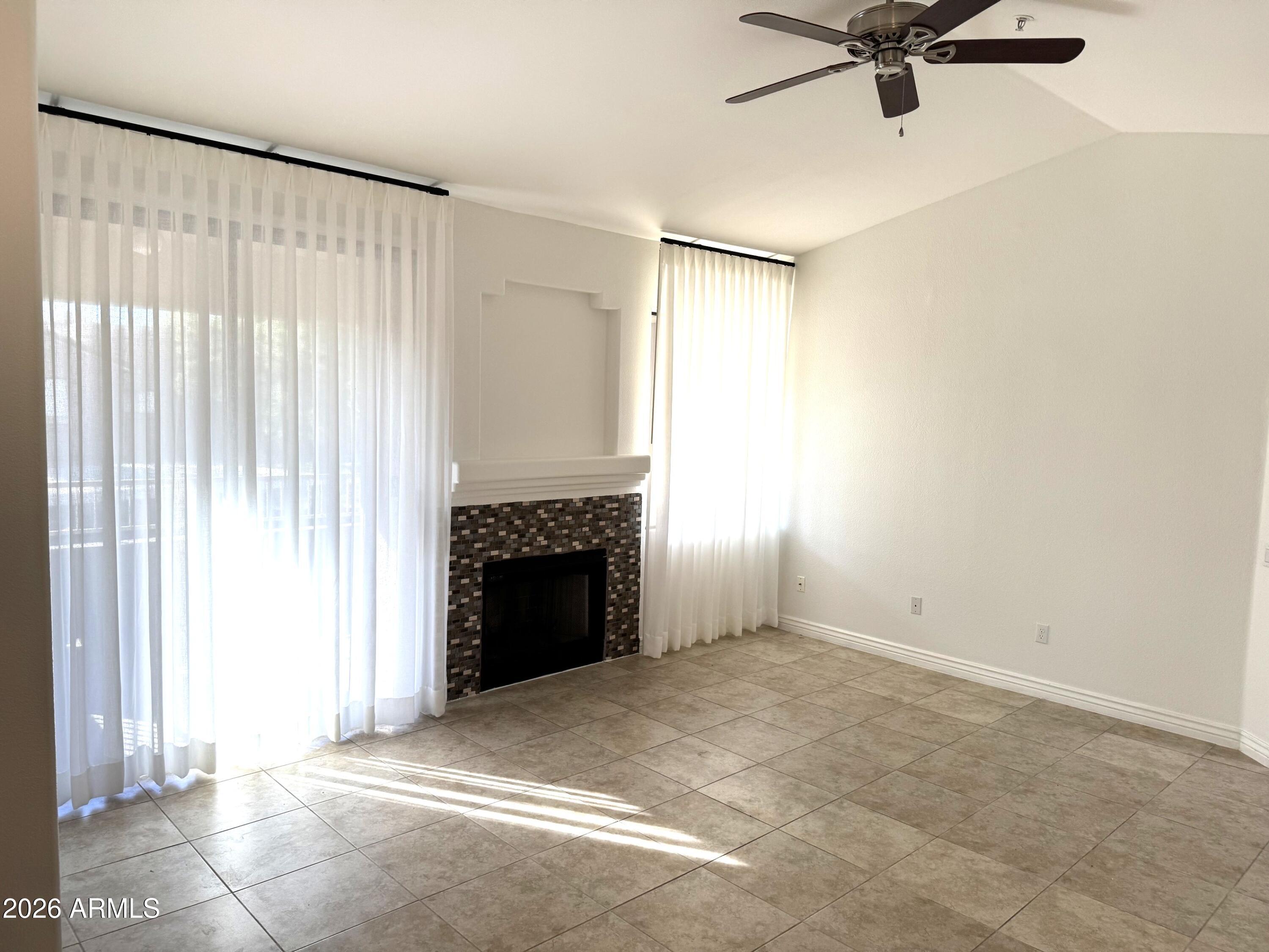 This beautiful condo offers the perfect blend of convenience and lifestyle. Enjoy the ease of walking to AJ's, Walgreens, and Safeway through a charming underpass tunnel. Located in a gated community, this upstairs end unit sits near the tennis courts and features a spacious covered patio--ideal for relaxing outdoors. Residents can take advantage of the sparkling community pool or stroll across the street to Horizon Park. Perfectly situated near the 101 Freeway, WestWorld for the Barrett-Jackson Auto Show, and TPC Scottsdale for the Waste Management Open, this home puts you at the center of it all.