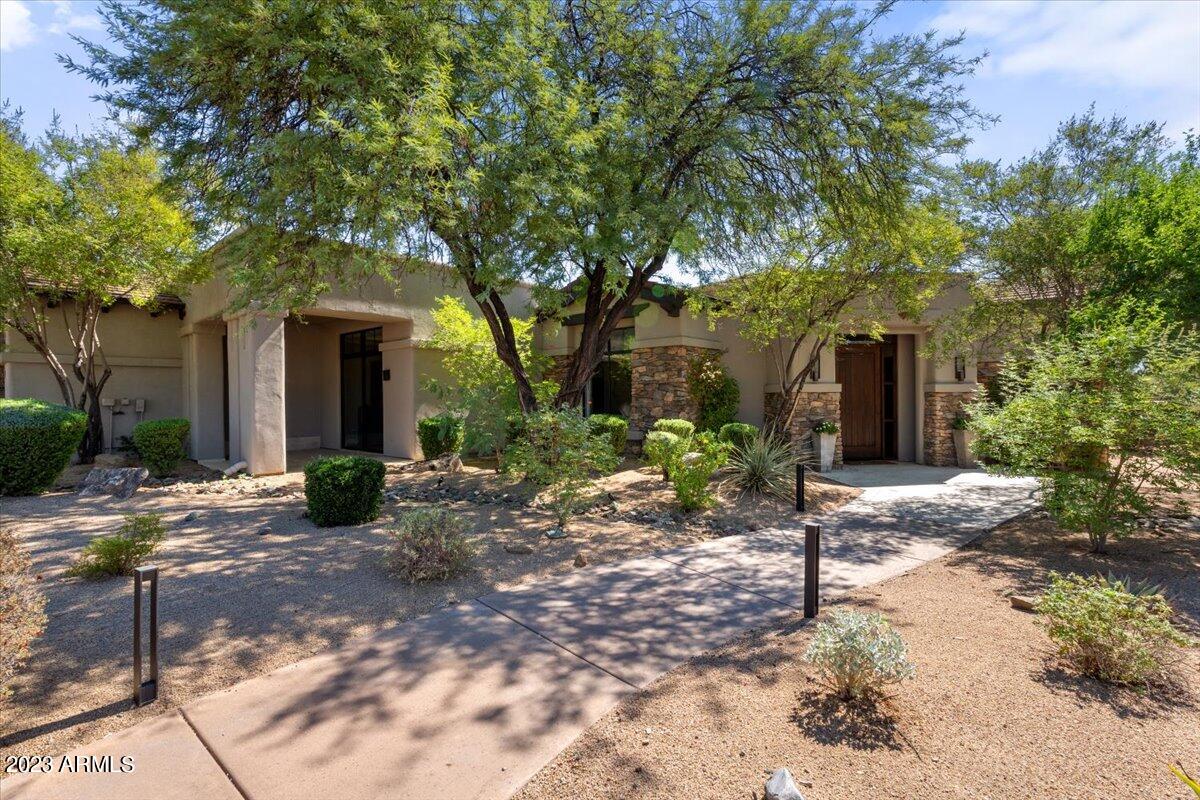 Beautifully updated single level home nestled within the private, gated community of The Country Club at DC Ranch offering sweeping McDowell Mountain views. This elegant, split level floorplan showcases 2 covered patios, impressive wood beams that stretch across the family room, trayed ceilings, luxurious light fixtures, and a tasteful bar enclave. The chefs kitchen features a 5 burner gas cooktop, dual ovens, SS appliances, center island, granite counters, sizable walk-in pantry, breakfast bar, and access to the front patio. The oversized primary suite offers dual vanities, a large soaking tub, and a fabulous tiled walk-in shower. The south facing backyard includes a misting system and heaters which are built-into the covered patio, a retractable awning, synthetic grass, built-in bbq, glass fire pit, and a heated pool & spa.