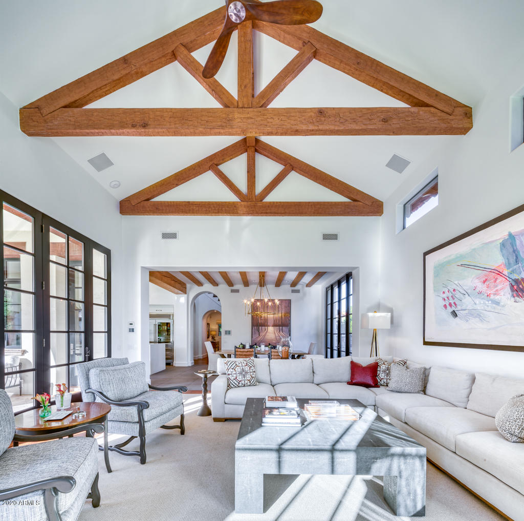 Romantically framed by mature lush grounds, this home features an extensive 2017 interior renovation by well-known interior designer, Donna Vallone. This private + timeless Cal Christiansen estate is situated at the end of a quiet cul-de-sac - the gated entrance leads to the main house via a long antique Chicago brick paver driveway past a 5-Car Garage with exercise room + casita. A Guest house sits at the back of the property. No expense was spared in the completely new, state-of-the-art kitchen, with Italian porcelain flooring, large center island, custom Tabarka backsplash + custom fixtures opening to a fabulous family room with  multiple glass doors and windows + statement wood beams. This Crestron smart home's unparalleled attention to detail + high-end finishes with Matte Brazilian