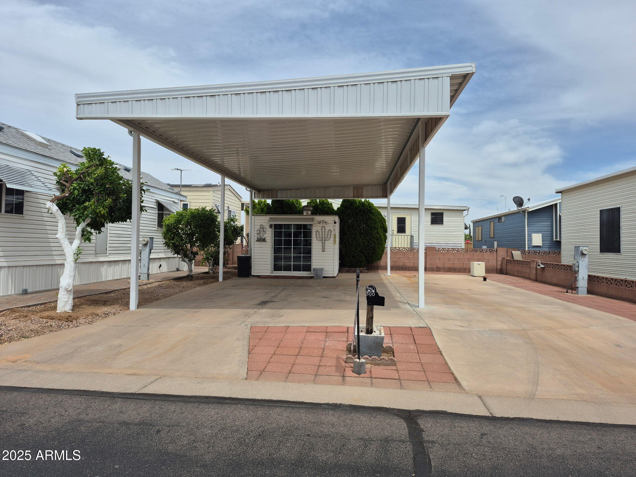 This is one of only a few RV lots left that is  located in Carriage Manor Resort, an active 55+ adult community where you OWN THE LAND! This lot does have a shed on it which houses a full size washer and dryer and has plenty of additional storage. It also has 3 orange trees that line the side of the property. Carriage Manor has 24/7 onsite security, a heated saltwater pool/spa, fitness facility, Tennis, Pickle ball, Golf Club, Onsite heated pool/spa, nice fitness facility, Tennis, Pickle ball, Golf Club, Billiards, Lapidary/Silversmith, Sewing, Wood shop, Bingo, Dances parties & many more activities & amenities.