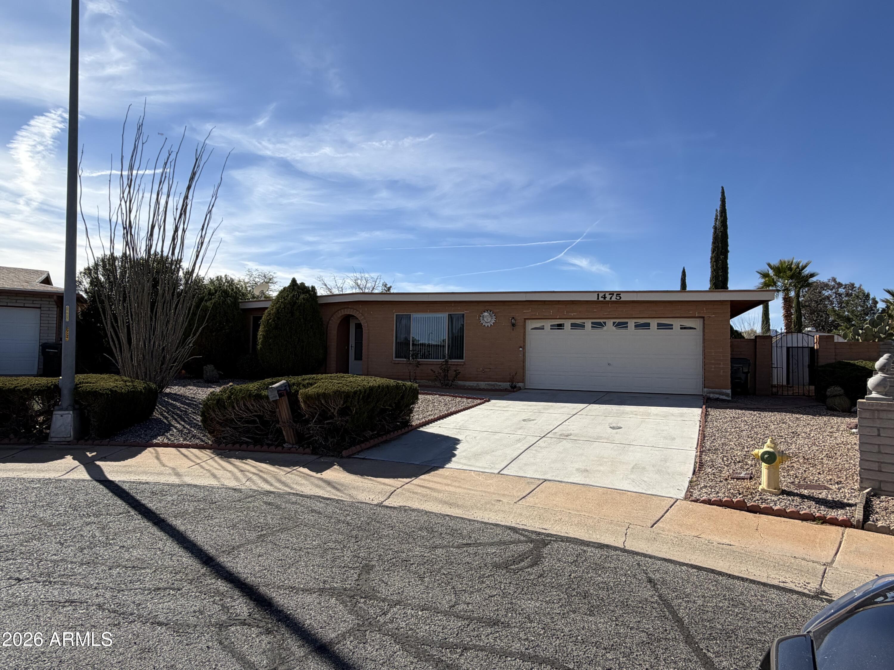 This spacious split 4-bedroom, 2-bathroom rental in Sierra Vista, AZ, offers 2,001 sqft of comfortable living space, perfect for families or professionals. NEW laminate flooring throughout, with freshly painted interior walls, doors and new baseboards. This home is located on a cul-de-sac lot with TONS of space for outdoor enteratining and FUN! The master bedoom is enormous as well as the other 3 bedrooms that are on the opposite side of the home. Located close to shopping, top-rated schools, Fort Huachuca, and Canyon Vista Medical Center, convenience is at your doorstep. The home features all-new dual-pane windows for energy efficiency, a water softener, and a two-car garage with plenty of storage. The fully fenced backyard includes a storage shed and an additional detached garage.
