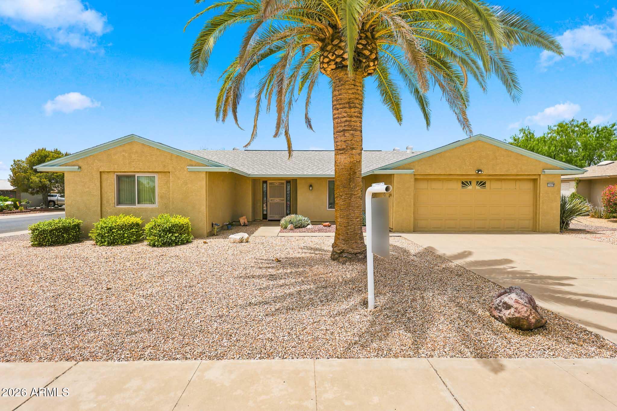 Welcome to this highly sought after Georgetown model in the heart of Sun City! Pride of ownership shines throughout with beautifully remodeled bathrooms completed in 2024 featuring stunning walk in tile showers, modern finishes, and a dual sink vanity. Newer premium luxury vinyl flooring adds style and durability throughout the main living areas. The spacious floor plan offers comfortable living spaces plus an enclosed Arizona room perfect for relaxing, hobbies, or entertaining year round. Step outside to a large screened patio, mature landscaping, and a partial fenced backyard ideal for pets. The extended garage includes built in cabinetry, a workbench, and plenty of extra storage space. Low property taxes and endless Sun City amenities make this an opportunity you won't want to miss!