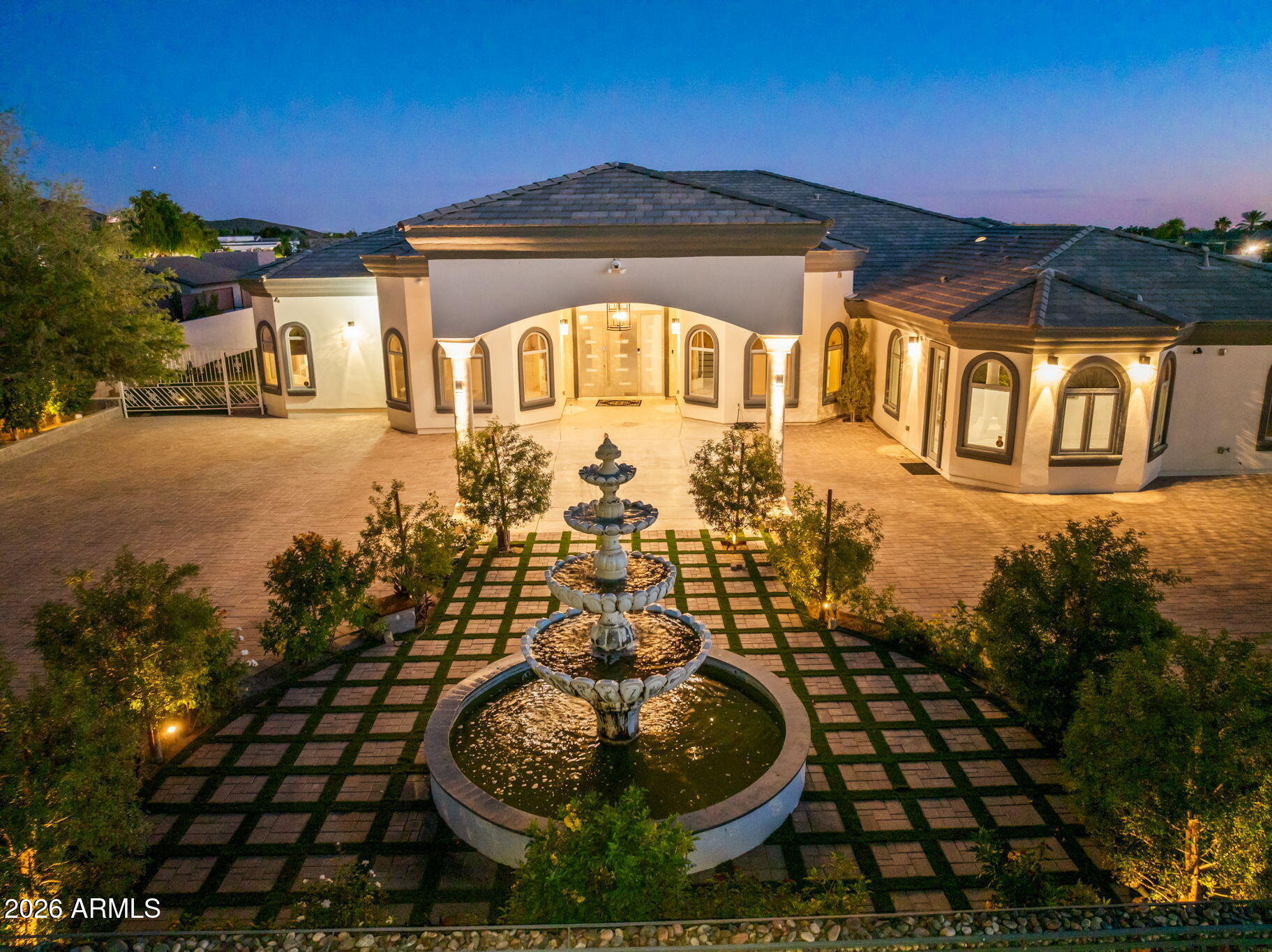 CUSTOM ESTATE | OVER 1 ACRE | NO HOA | 2 GUEST HOMES I WORKSHOP | RESORT BACKYARD Stunning custom estate on 1.28 acres featuring 5 bed + media room, 7.5 baths, and 2 private guest home. Thoughtfully designed with a gourmet kitchen showcasing quartz countertops and top-of-the-line appliances. Luxurious primary suite offers expansive custom closets and a spa-inspired bath. Enjoy a private media room with its own bath. Resort-style backyard includes two ramadas, outdoor kitchen, BBQ, fireplace, and a sparkling pool with spa. Tennis/basketball court, mature fruit trees, and lush landscaping provide ultimate privacy. Oversized workshop with guest Qrts , bath, and space for 3+ vehicles. 3-car garage, 2 carports, and grand water feature entry complete this exceptional property.