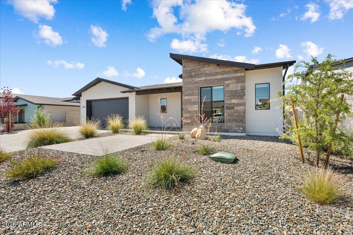 This Mandalay combines comfort with eco-conscious living offering a spacious 2,402 sq ft layout featuring 3 bedrooms plus a den, 2.5 bathrooms, and a 3 car attached garage.
The primary suite boasts a generous walk-in closet and a luxurious owner's bathroom designed for ultimate relaxation. Culinary enthusiasts will enjoy the kitchen's granite countertops and modern appliances.
Enjoy cozy evenings by the gas fireplace or entertain guests on the extended covered patio. The paver driveway adds a touch of elegance to your exterior, while front and rear landscaping complete this beautiful setting. With solar panels included, you can relish in reduced energy bills and a smaller carbon footprint. Come experience Jasper!