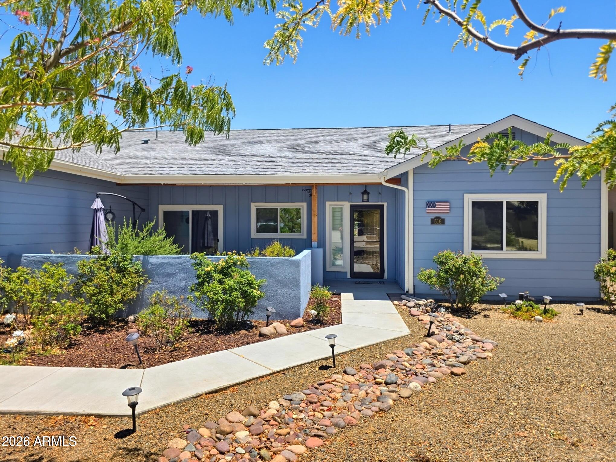 Beautiful custom 3-bedroom, 2-bath home in the sought-after The Views at Camp Verde! This split floor plan offers vaulted ceilings, real hickory wood floors, and an open-concept design. The spacious kitchen features Shaker white cabinets, granite countertops, and ample counter space. A welcoming front patio adds to the home's curb appeal, while the covered back patio overlooks the spacious backyard and beautiful mountain views. Located in a quiet community, this home also includes solar panels, a 2-car garage, and convenient access to shopping, dining, I-17, the Verde River, and outdoor recreation.