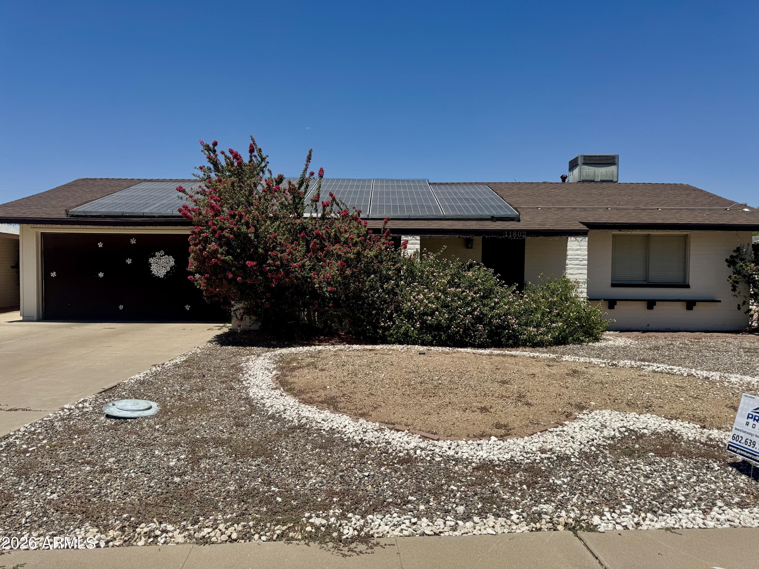 Welcome to this energy-efficient solar home offering low-maintenance living in the desirable golf course community of Sun City. Designed for comfort and convenience, this inviting home features an open floor plan, neutral finishes, a built-in entertainment center, and a formal dining area. The kitchen boasts abundant wood cabinetry, stylish countertops, stainless steel appliances, and tile flooring. Enjoy two spacious bedrooms plus a versatile bonus room, updated baths, a den, and an Arizona room with a hot tub. The private backyard is complete with a paver patio and easy-care desert landscaping. Ideally located near recreation centers, golf, shopping, dining, and everyday amenities. A fantastic opportunity to own a move-in-ready Sun City home that's priced to sell.