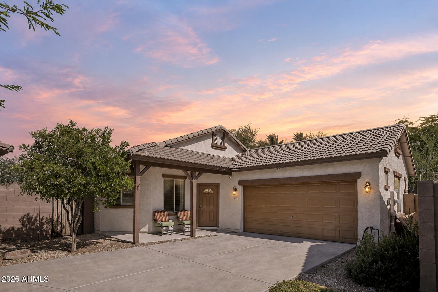 Located in a secluded gated community in the highly desirable Peoria area, this beautifully updated home offers resort-style amenities including a heated pool, spa, BBQ area, and lush greenbelt spaces. Situated on one of the largest lots in the community, the property features an extended driveway with room for up to four vehicles and an extended 2-car garage complete with 10-foot ceilings and epoxy flooring. Inside, you'll love the spacious split-bedroom floor plan and open great room concept. The stunning kitchen showcases granite countertops, refinished white cabinetry, a large island with a breakfast bar, stainless steel appliances, and a pantry. The spacious primary suite offers dual sinks, a separate tub and shower, and a walk-in closet... Two additional generously sized bedrooms provide flexibility for guests or a home office. The backyard is designed for easy Arizona living with a covered patio, turf grass area, rock landscaping, and plenty of space to relax or entertain. Fresh interior and exterior paint make this home truly move-in ready. Conveniently located near P83, Bell Road, Arrowhead Towne Center, dining, shopping, and entertainment.