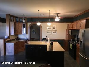 One of a kind custom home in desirable Wild Horse. This Craftsman style home boosts 3841 sqft of character and uses intricate detail throughout the home. With hardwood and Italian tile floors, stained glass window accents and quality wainscoting, this home shows pride of ownership from top to bottom. Must see to truly appreciate the panoramic views this property has to offer.