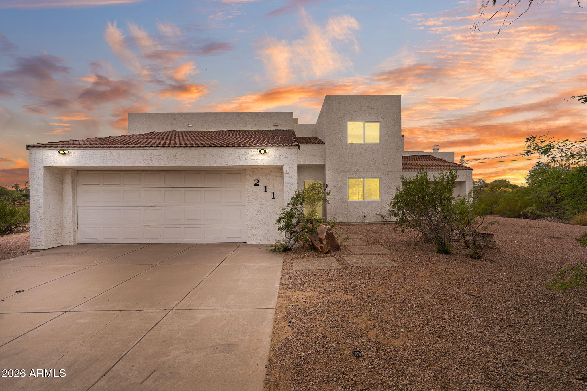 AMAZING custom home built on nearly 2 acres, tucked in a prominent community at the base of Papago Mountain. Three large bedrooms, two baths, sunrise balcony off the master, real wood fireplace in a quaint conversation pit, entertainers patio overlooks sunset over Papago mountain preserves. The property is walking distance to the Phoenix Zoo, the botanical gardens, museums, public pool, Golf courses and historical Old Town Scottsdale. There are only 13 coveted properties in this hidden desert paradise, with all prominent homeowners. This will be the buy of a lifetime! This opportunity will not come along again, don't miss out on a chance to own this unique home! Build a guest house, large workshop, put in a beautiful pool! The possibilities are endless! 

A truly unique offering with endless possibilities in one of Tempe's most desirable growth corridors--don't miss this rare chance to capitalize on a versatile and high-demand location!