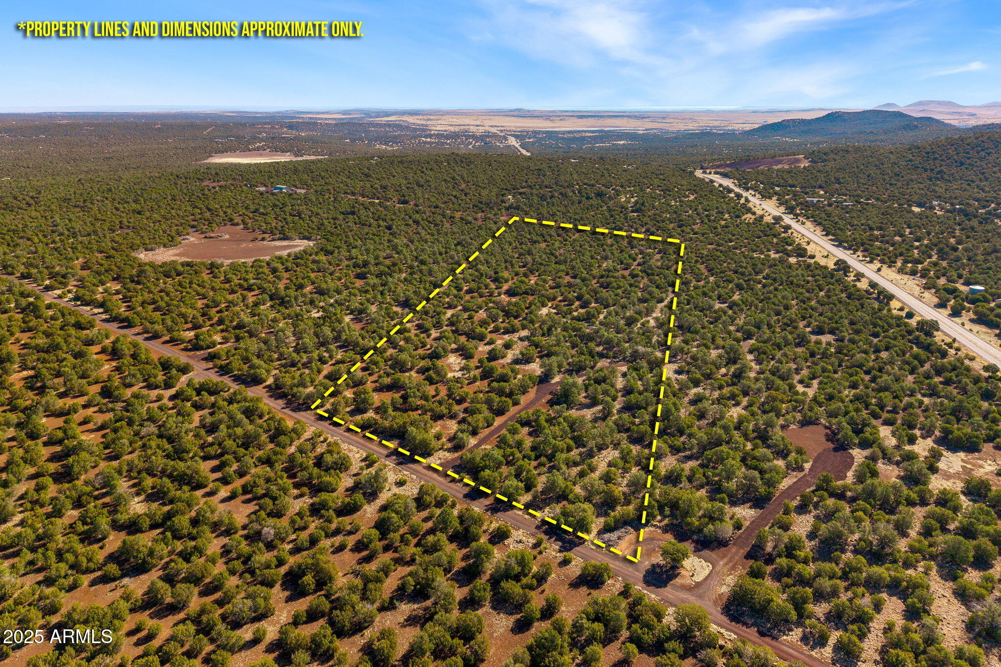 This unique property has so much to offer. Wildlife and bird watching is abundant and the views of higher peaks surrounding the area are spectacular. The property is a 15 minute drive to the town of Show Low, the commerce center of the area. Convenient access from State Route 61 provides clean access without driving for miles over rough and muddy roads. The main entrance from Route 61 is private, and gated, and the main road is maintained by agreement. Electricity available at lot line, this property is ready for your primary home or seasonal retreat in the White Mountains.