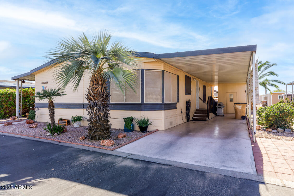 Beautifully maintained 2BR/2BA home in Sierra Dawn, a vibrant 55+ community in Surprise. Vaulted ceilings, open great room with formal dining, breakfast nook/bar, and a kitchen with island and crown molding. Two master suites with walk‑in closets, double‑door baths, large Roman tub and separate showers; grab bars for safety. Laundry with W/D, flex room with AC and storage, covered patio, ramp access front and back, 2‑car covered carport and detached exterior storage. Recent paint, 3‑year flooring, 2'' wood‑look blinds, ceiling fans throughout. Community amenities: pool, heated spa, pickleball, shuffleboard, horseshoes, fitness room, dog park, and community room. Near Arrowhead Mall, P83 dining and easy freeway access.