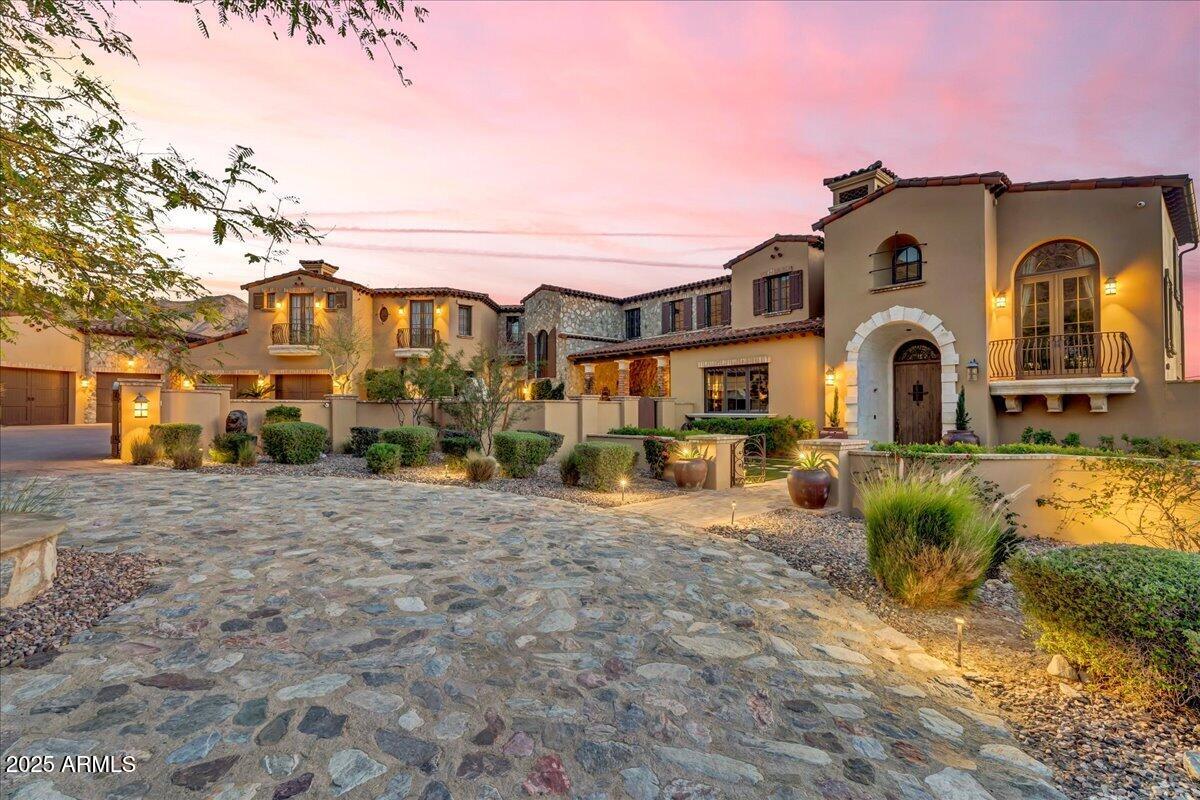 SILVERLEAF GOLF MEMBERSHIP OPPORTUNITY! Nestled in the guard-gated Silverleaf community, this exceptional 1.35-acre estate offers luxury, privacy, and stunning views of the Sonoran Desert, city lights, and Scottsdale Airpark. Features include a 9-car garage with car lifts, a versatile flex space ideal for a golf simulator, gym, or indoor pickleball court, plus a 1,000+ bottle wine cellar. Experience refined craftsmanship in this Upper Canyon masterpiece designed by architect Mark Candelaria. Don't hesitate, arrange your private home and club tour today. The interior features dramatic vaulted ceilings, custom woodwork, and hand selected stone accents that set the tone for an elegant living environment. The gourmet kitchen is a chef's delight, showcasing custom cabinetry, sleek countertops, and a premium Wolf range. An expansive island with a breakfast bar seamlessly connects the culinary area with a generously proportioned living space, ideal for both intimate gatherings and large celebrations.

Retractable glass doors invite abundant natural light into every corner, effortlessly blending indoor and outdoor living. This thoughtful design extends to a bright sunroom that offers a peaceful retreat, and further into an outdoor oasis complete with an infinity edge pool and private spa. The meticulously landscaped grounds, accented by comfortable lounge areas, create a resort style setting perfect for relaxation and entertaining.

Despite its serene and secluded atmosphere, this property is conveniently located just minutes from Scottsdale's world class amenities, including top rated golf courses, fine dining, upscale shopping, and scenic hiking trails, offering the perfect blend of tranquility and vibrant lifestyle amenities.

This Silverleaf estate represents the epitome of upscale living in Scottsdale, a harmonious fusion of modern sophistication and timeless elegance. It is a rare opportunity for those with refined taste seeking an extraordinary lifestyle. Experience the ultimate in luxury and comfort at this remarkable property, where every detail has been carefully curated to deliver an unrivaled living experience.