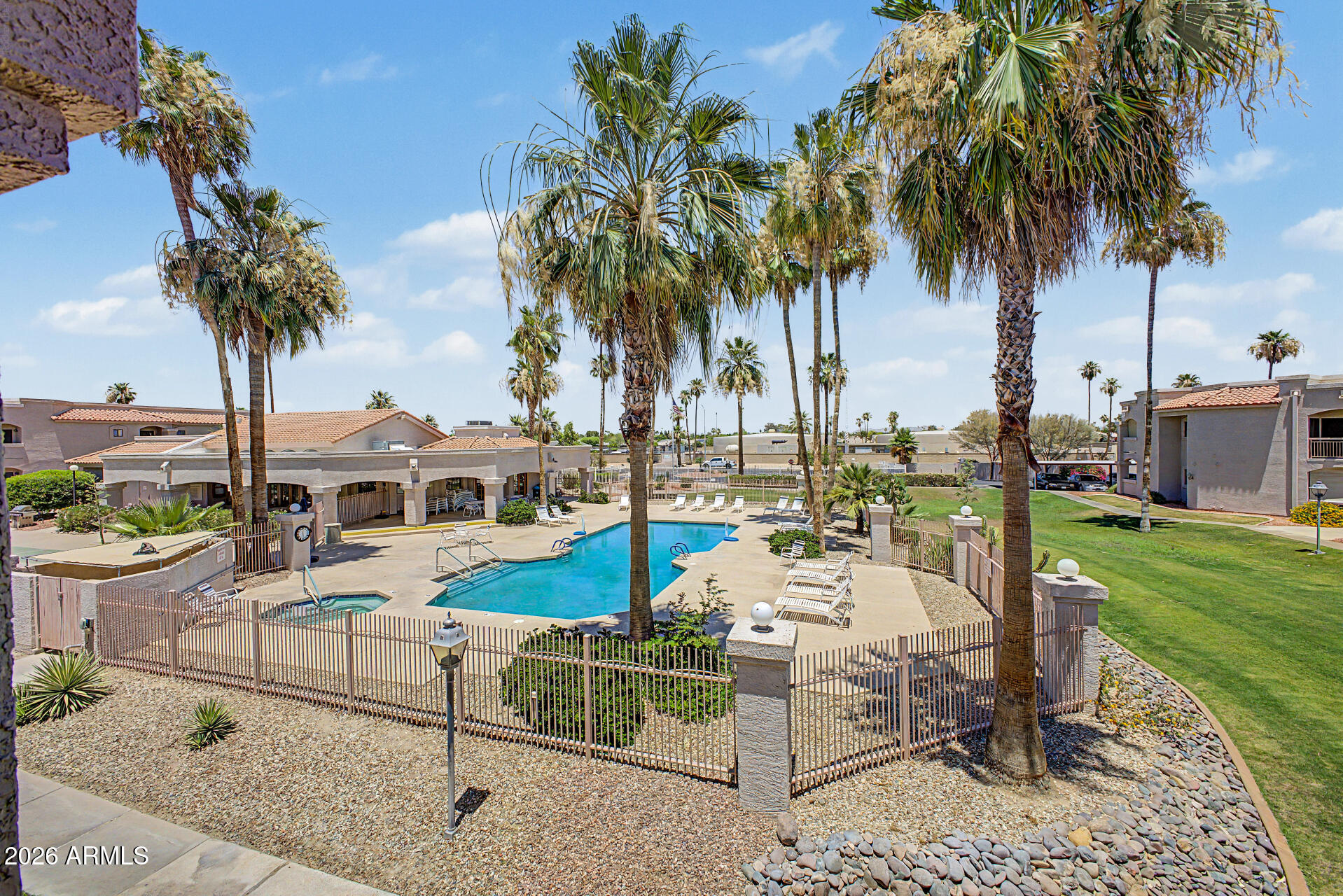 Welcome to Greenway Palms, a highly sought-after gated 55+ lake community in the heart of Peoria. This beautifully maintained and fully furnished 2-bedroom, 2-bath condominium offers comfortable, low-maintenance living and is move-in ready for full-time residents or seasonal visitors alike. The bright and inviting floor plan provides functional living spaces, while the assigned covered parking space adds everyday convenience. Residents of Greenway Palms enjoy access to the scenic lakes and walking paths of the surrounding Desert Harbor community, creating a beautiful setting for morning strolls, relaxation, and enjoying Arizona's outdoor lifestyle. Community amenities include a clubhouse, heated pool and spa, fitness center, shuffleboard courts, and a variety of social activities. Ideally located near Arrowhead shopping, dining, golf courses, medical facilities, and entertainment, this home offers the perfect combination of comfort, convenience, and a vibrant lifestyle in one of Peoria's most desirable active adult communities.