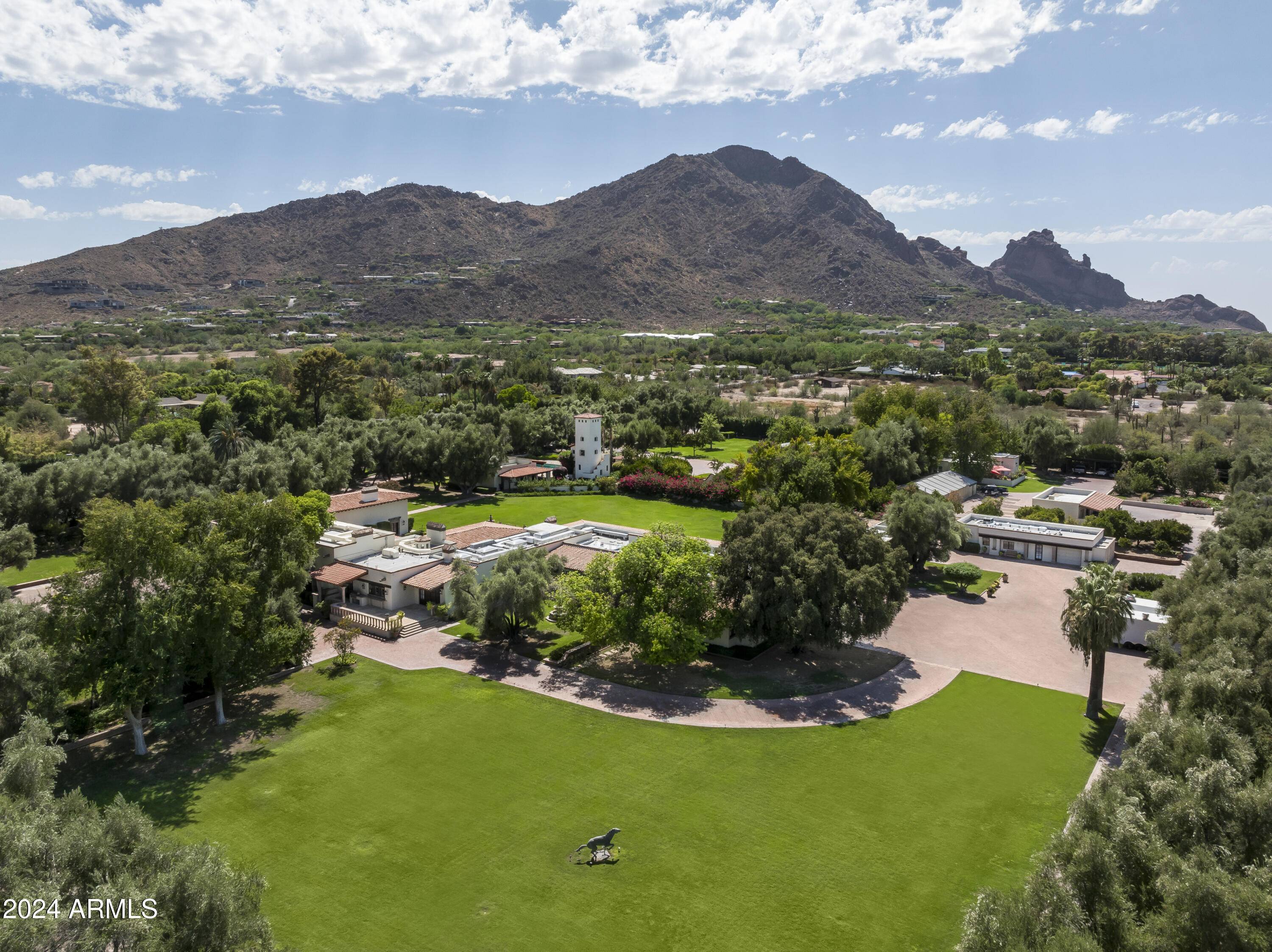 In the most prestigious neighborhood, in the most prestigious town in Arizona, sits an exquisite 9.14 acre multi-residence compound like no other. This is the largest available non-hillside, fully landscaped, flat estate in Paradise Valley. More information available!
