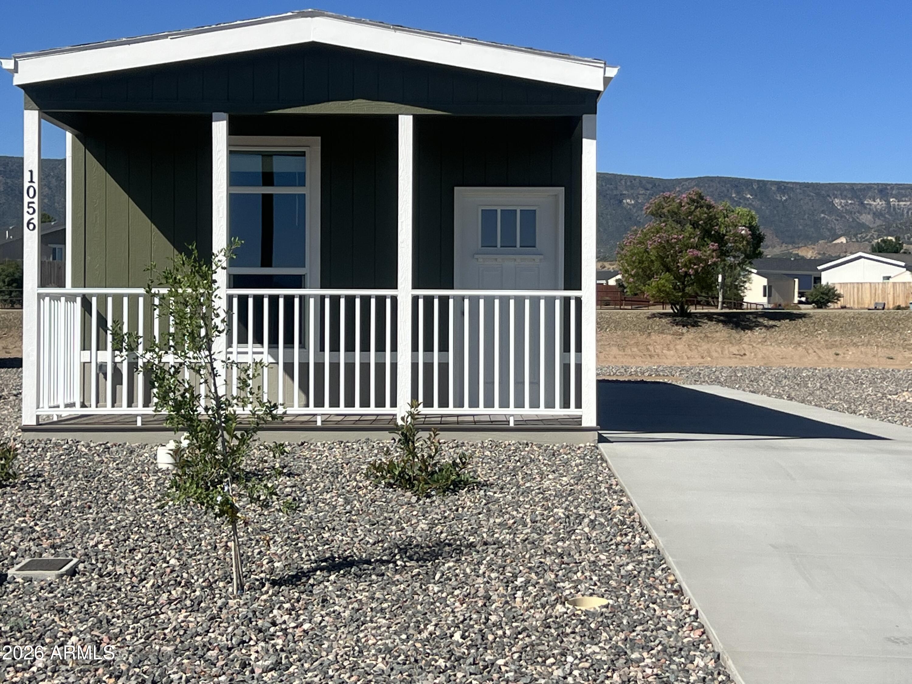 This is an all ages gated community located right in the heart of it all! 90 minutes from Phoenix and a short ride to Cottonwood, Sedona, and Flagstaff. Adorable 2 bedroom, 1&3/4 bath manufactured home with upgraded stainless steel kitchen appliances, Vinyl flooring covered Car Port, fenced back yard, 10'x10' storage shed. Residents enjoy on-site amenities at the 10,000 sq ft. entertainment-filled clubhouse with heated pool, hot tub, pickleball courts, dog park, fitness center and neighborhood activities. Community is adjacent to an undeveloped state park. Lot lease is $583.00 monthly. Must pass background check.