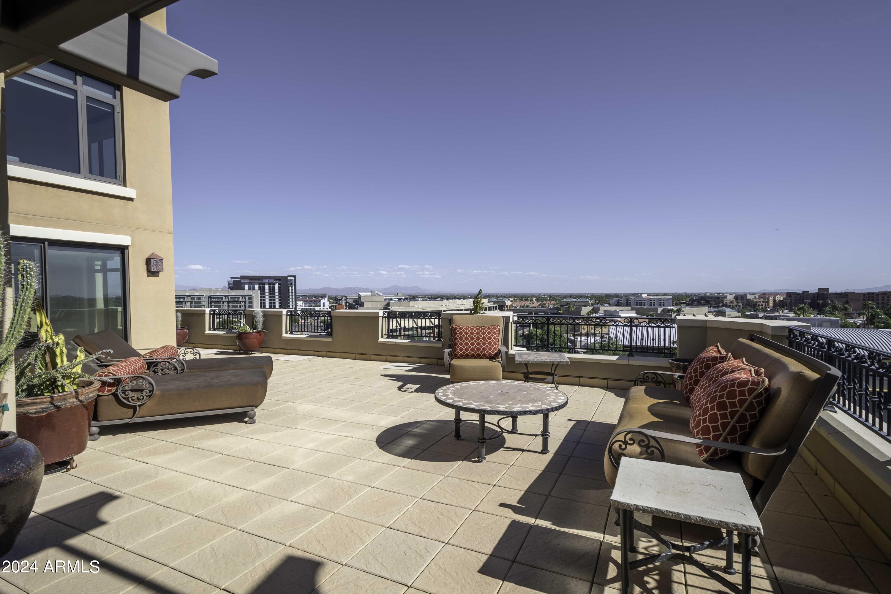 Step into the heart of Old Town Scottsdale with this stunning luxury 2,300 sf Scottsdale Waterfront High-End Condo. Perched on the 7th floor, it offers breathtaking views that will make every sunrise & sunset feel special. A must-see and truly an incredible and rare find.  Recently remodeled, this stylish space invites you to unwind on its expansive 1,400 sf balcony. Imagine sipping your morning coffee while soaking in the vibrant energy of the city below. Enjoy the convenience of nearby shopping and exceptional dining. Whether you're seeking an investment or a new home, this condo blends comfort, elegance, security and location. It's the perfect lock-and-leave lifestyle waiting for you. Don't miss out on making it yours!